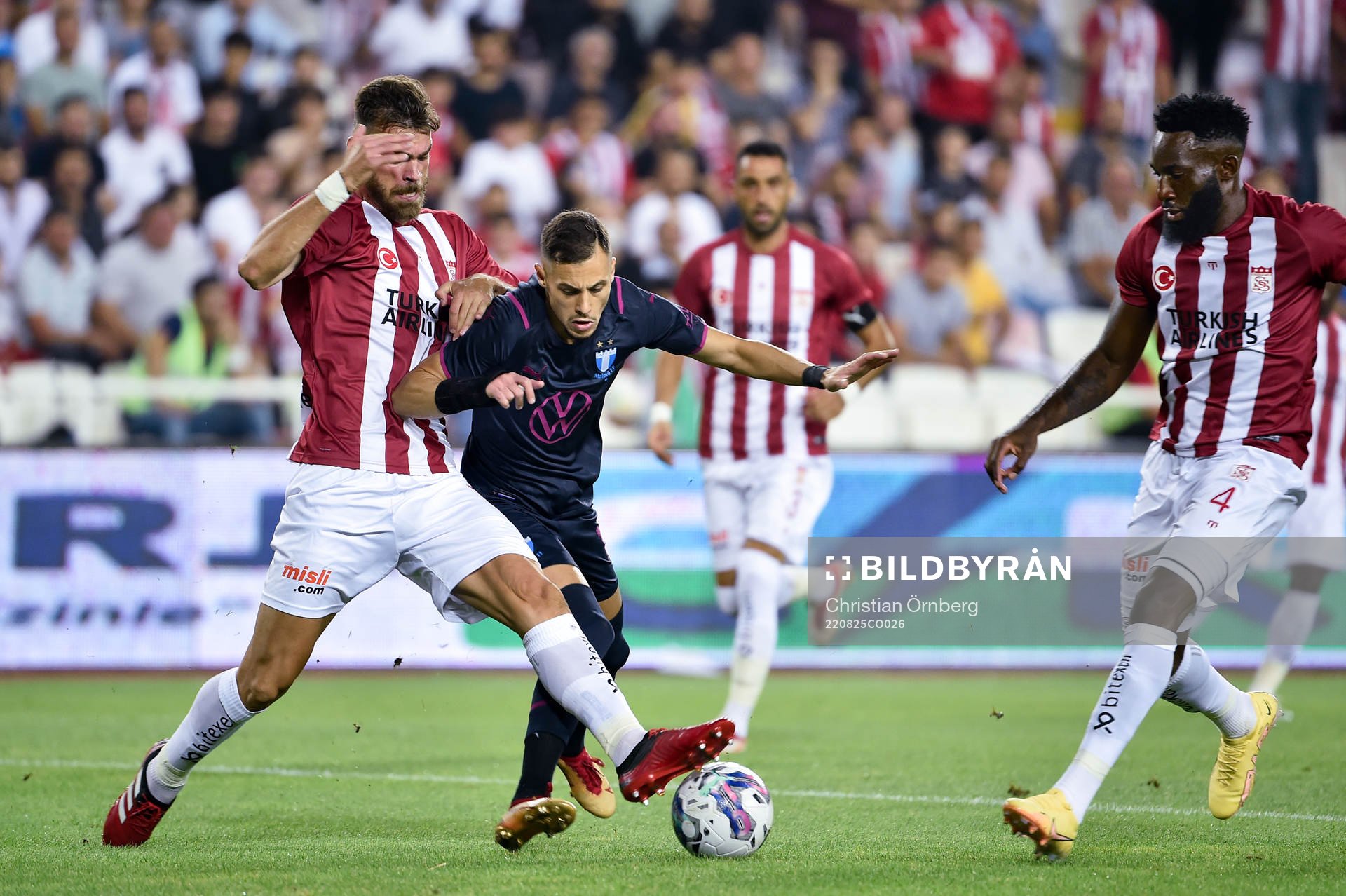 Dimitris Goutas and Aaron Appindangoye of Sivasspor against