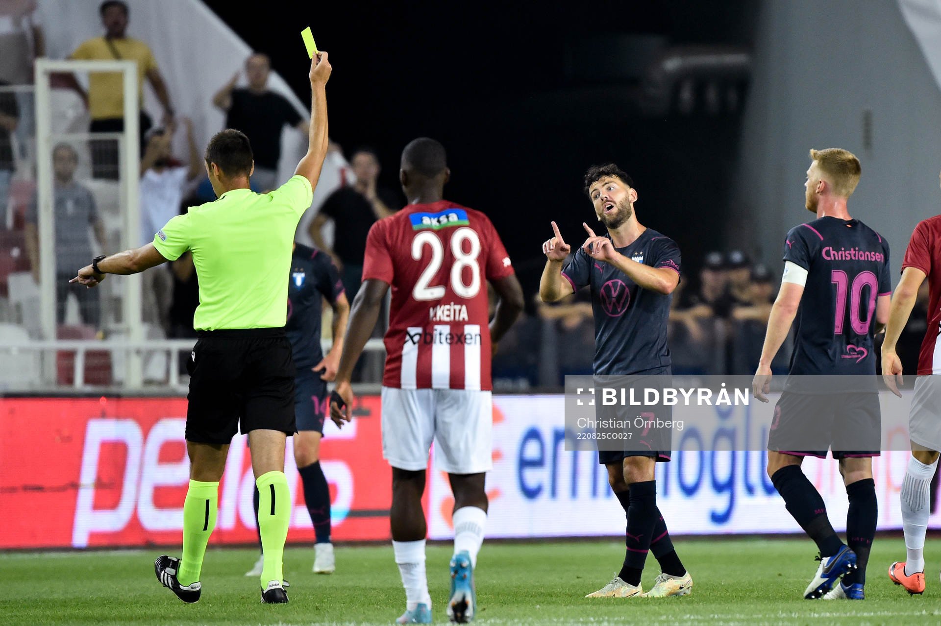 Sergio Pena of Malmö FF receives a yellow card