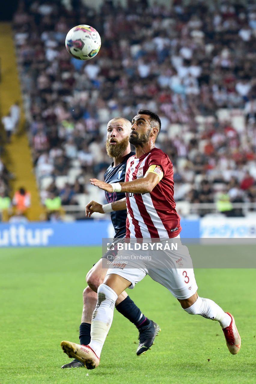 Jo Inge Berget of Malmö FF and Uğur Çiftçi of Slovacko