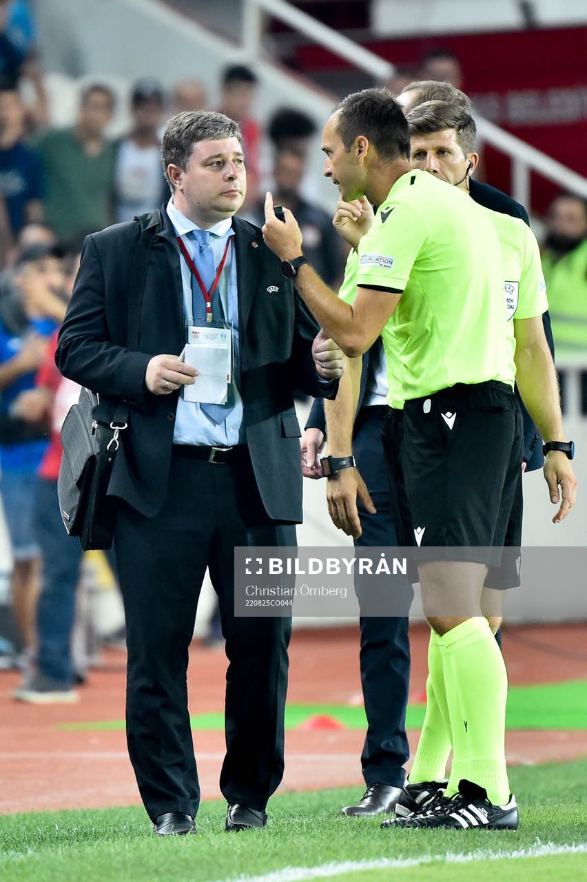 An official talks to the referee