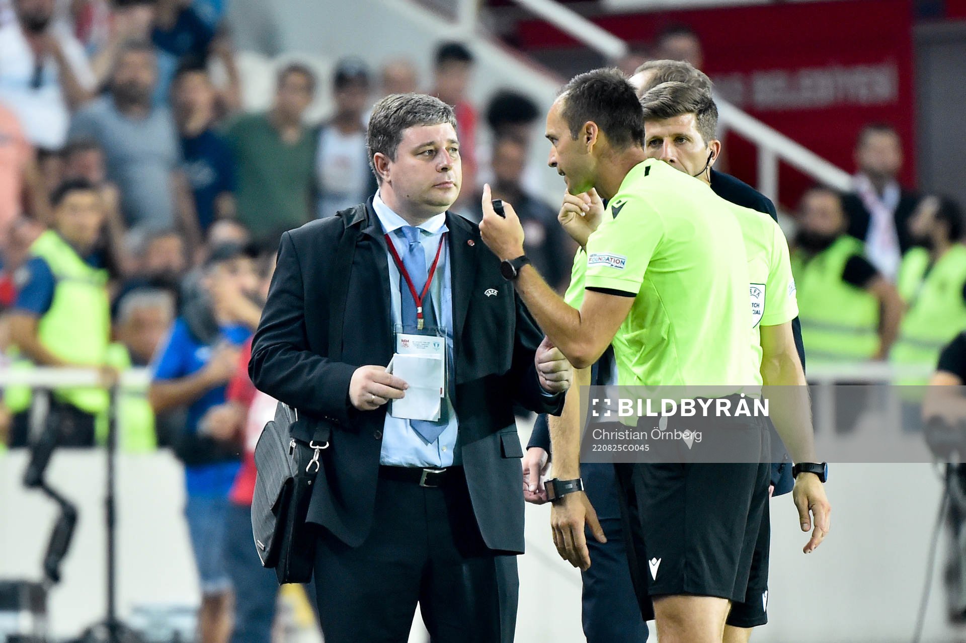 An official talks to the referee