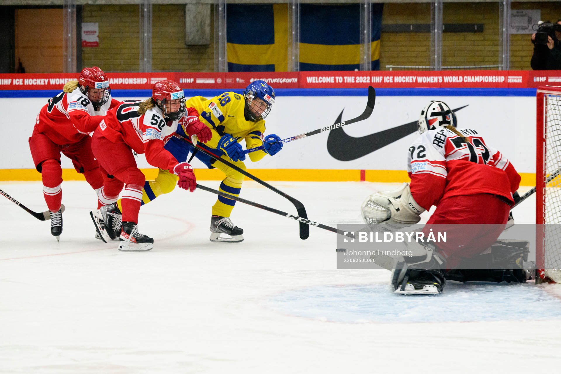 Maria Peters and Mia Bau of Denmark against Hanna Olsson of