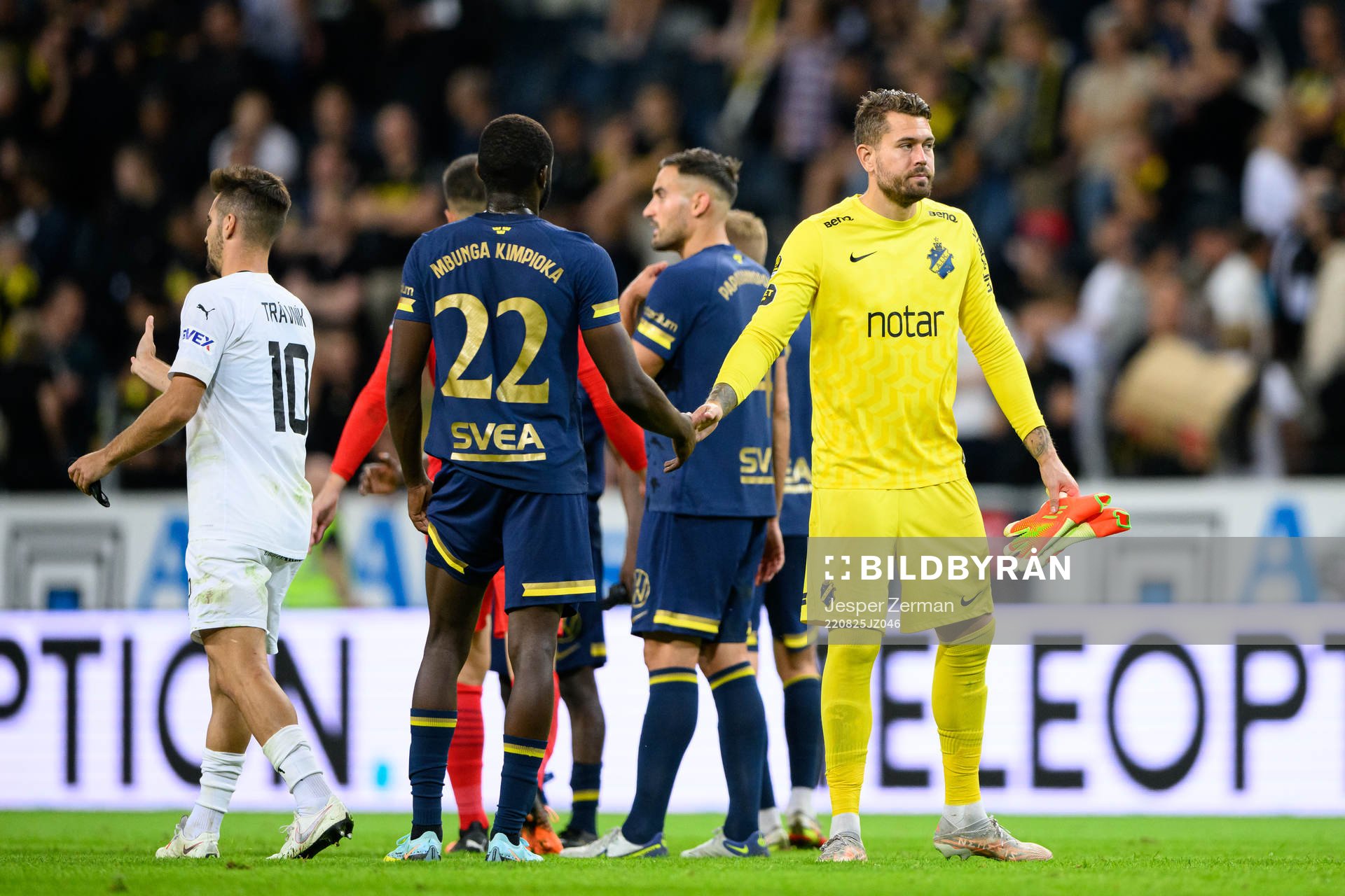 Benjamin Mbunga Kimpioka and goalkeeper Kristoffer