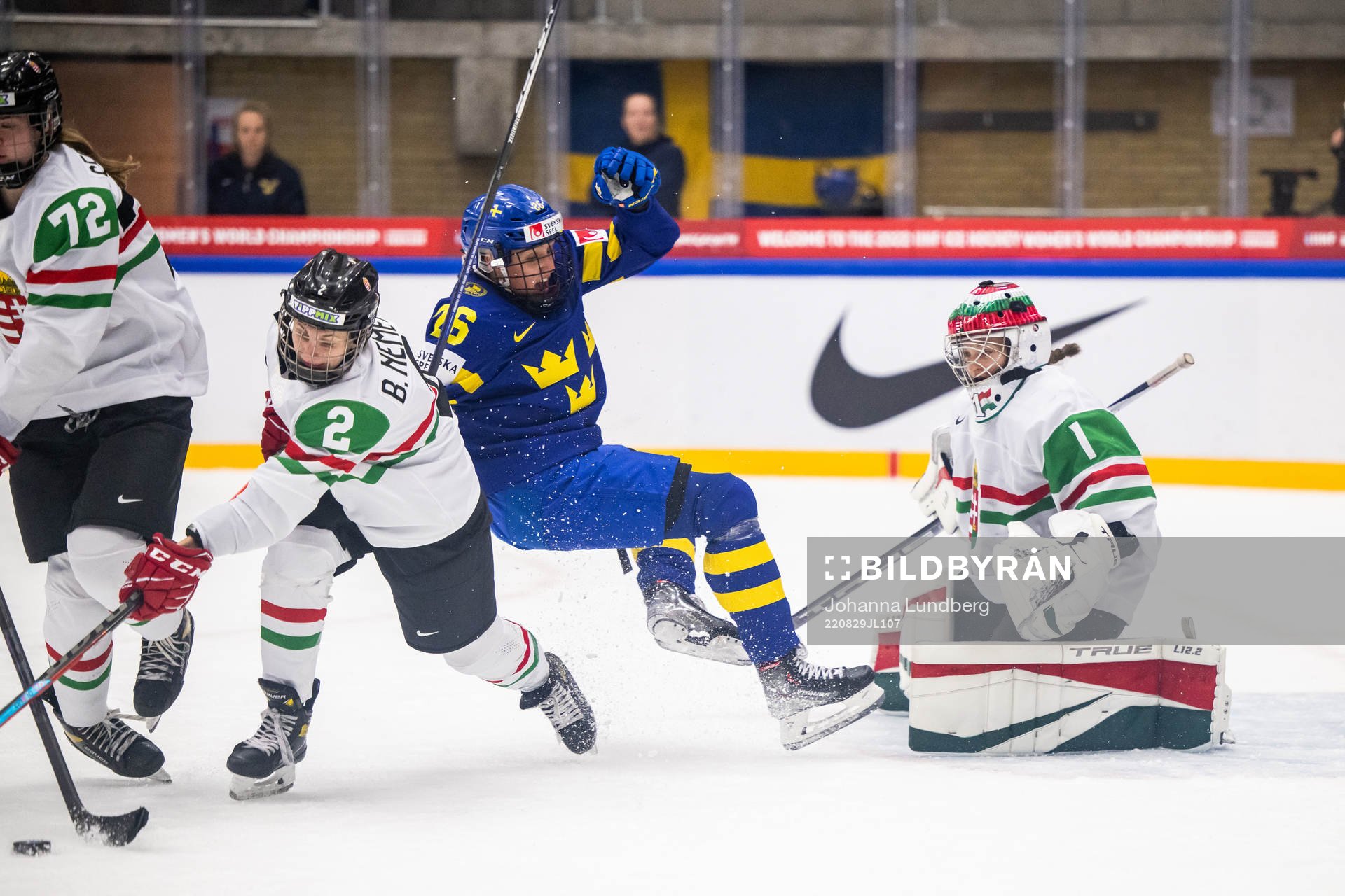 Bernadett Nemeth and goaltender Aniko Nemeth of Hungary and