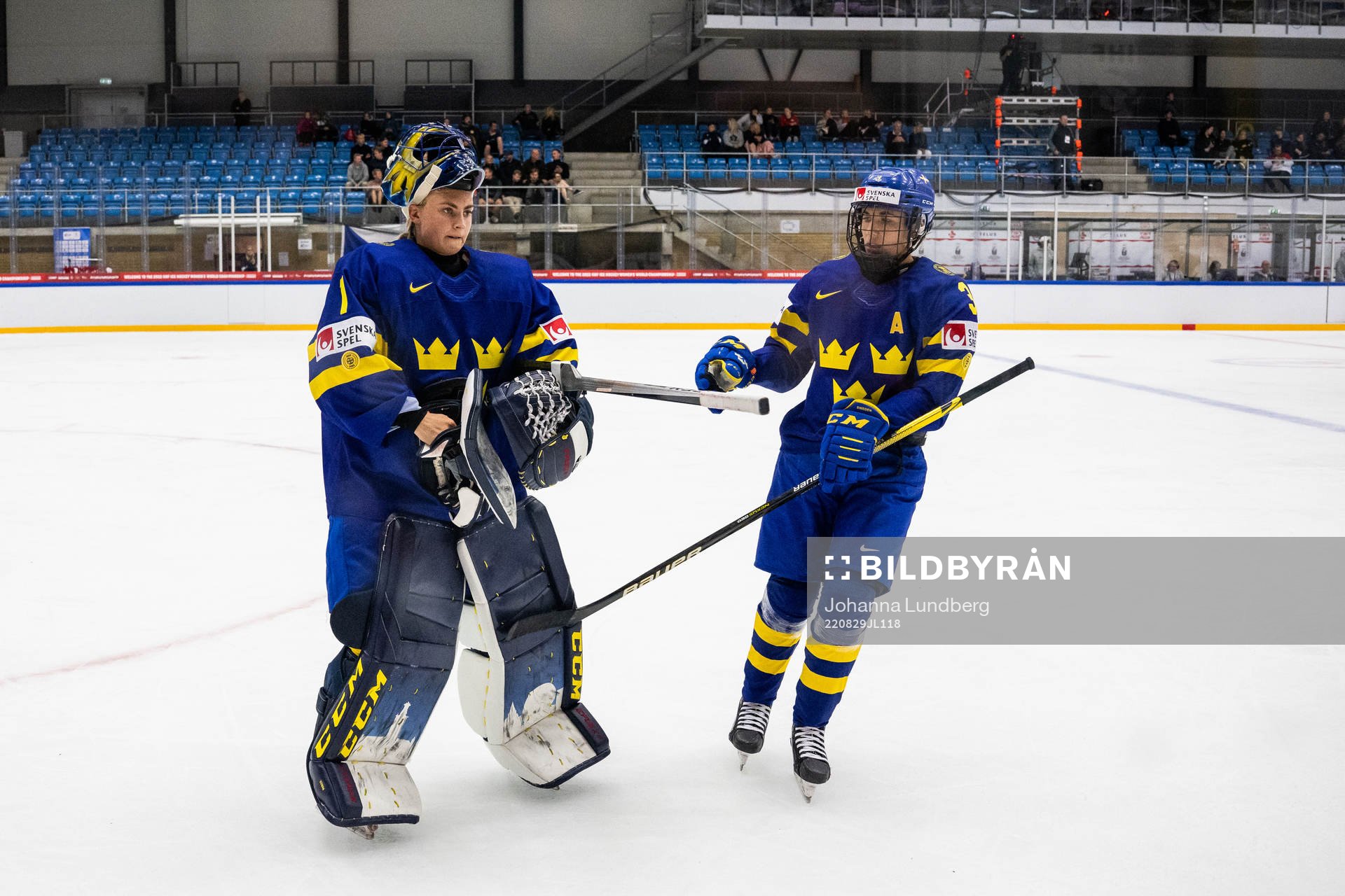 goaltender Ida Boman and Anna Kjellbin of Sweden