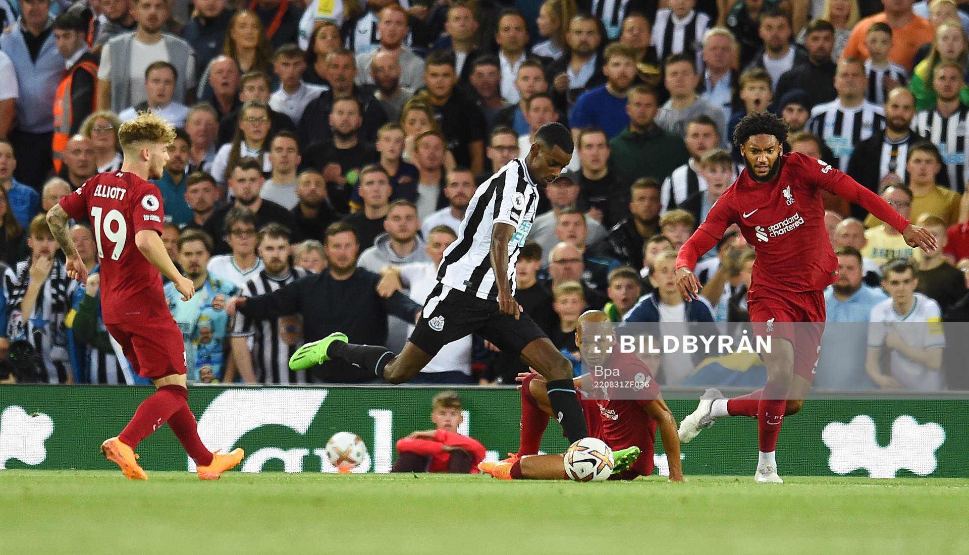 Alexander Isak of Newcastle United and Joe Gomez and