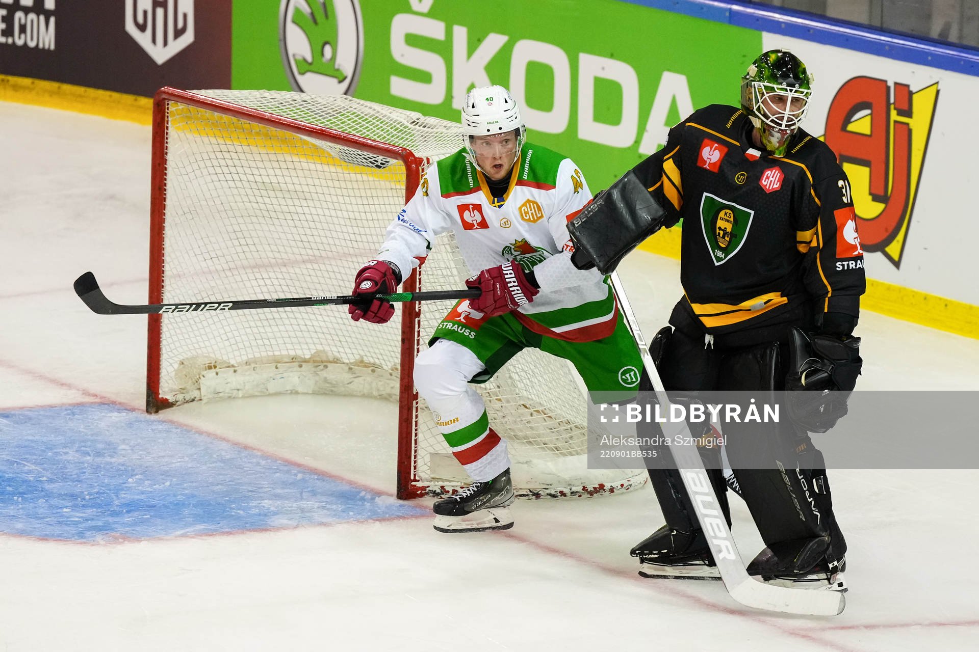 Oskar Stål Lyrenäs of Rögle and goalkeeper John Murray