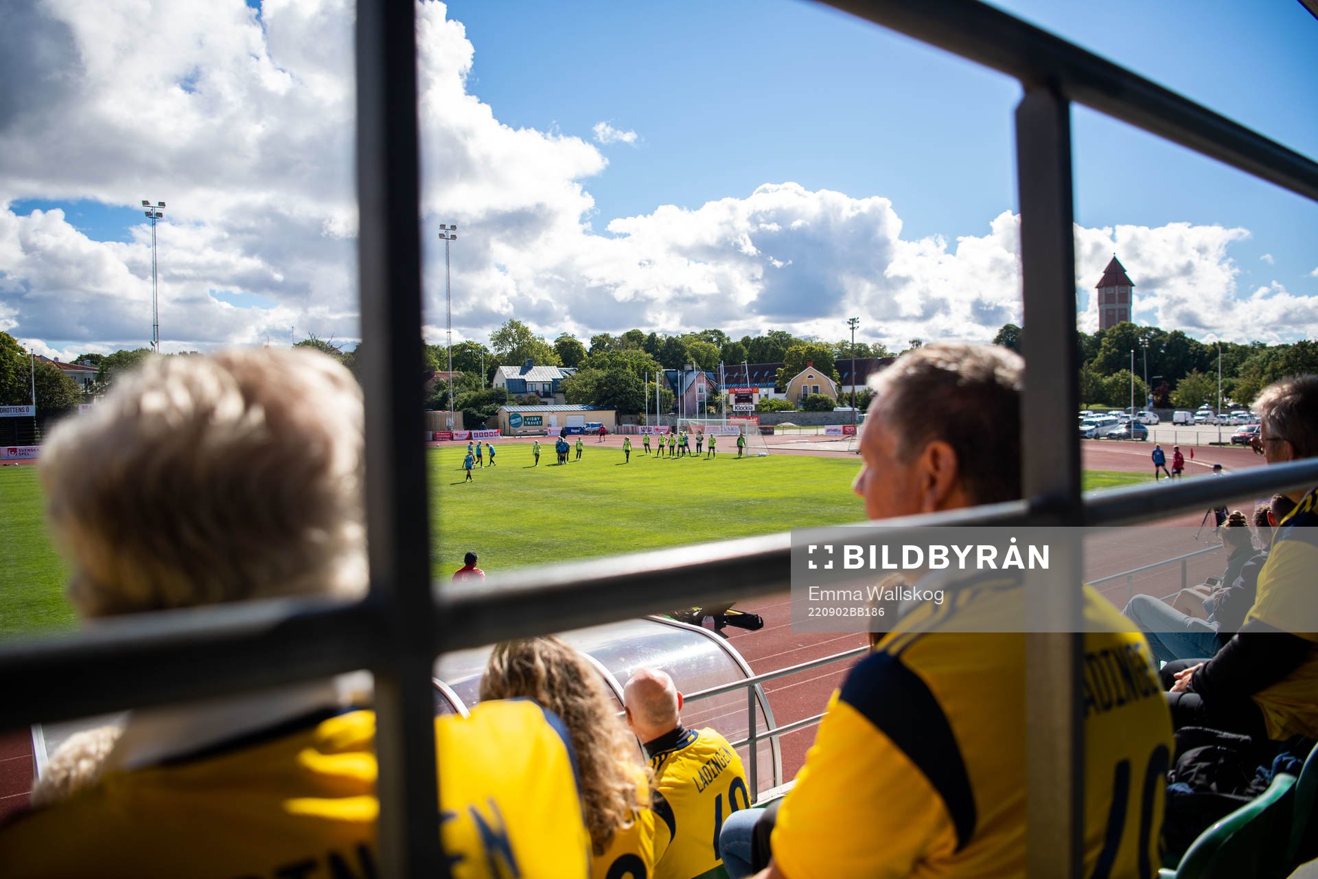 Spectators in the stands watching a training session with