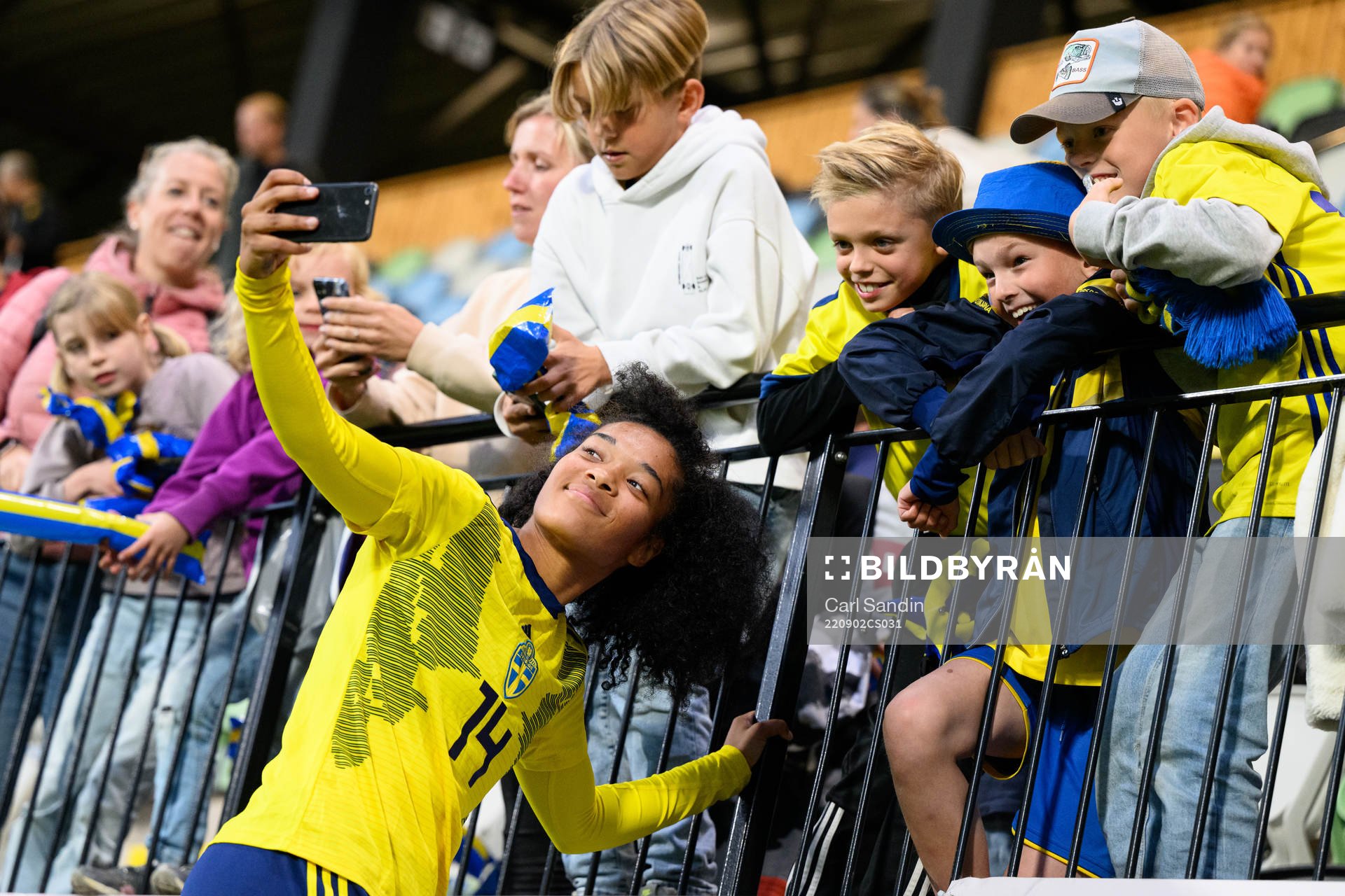 Evelina Duljan of Sweden takes pictures with the supporters