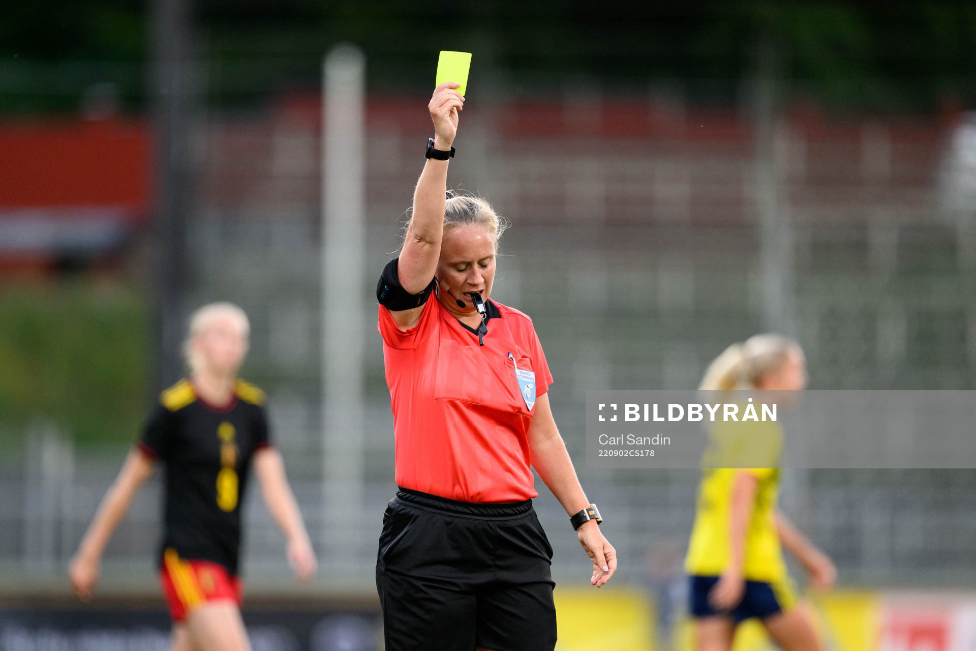 Referee Sandra Almkvist shows a yellow card