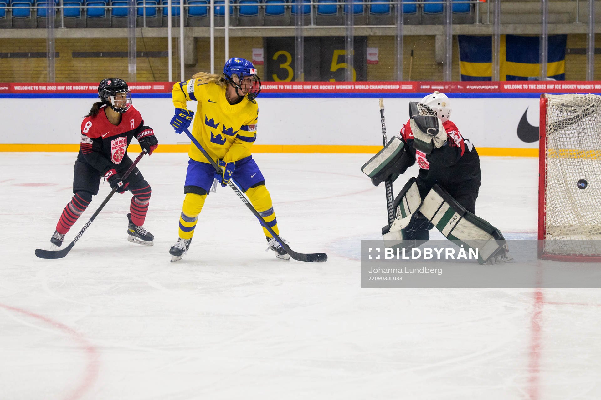 Akane Hosoyamada and goaltender Miyuu Masuhara of Japan