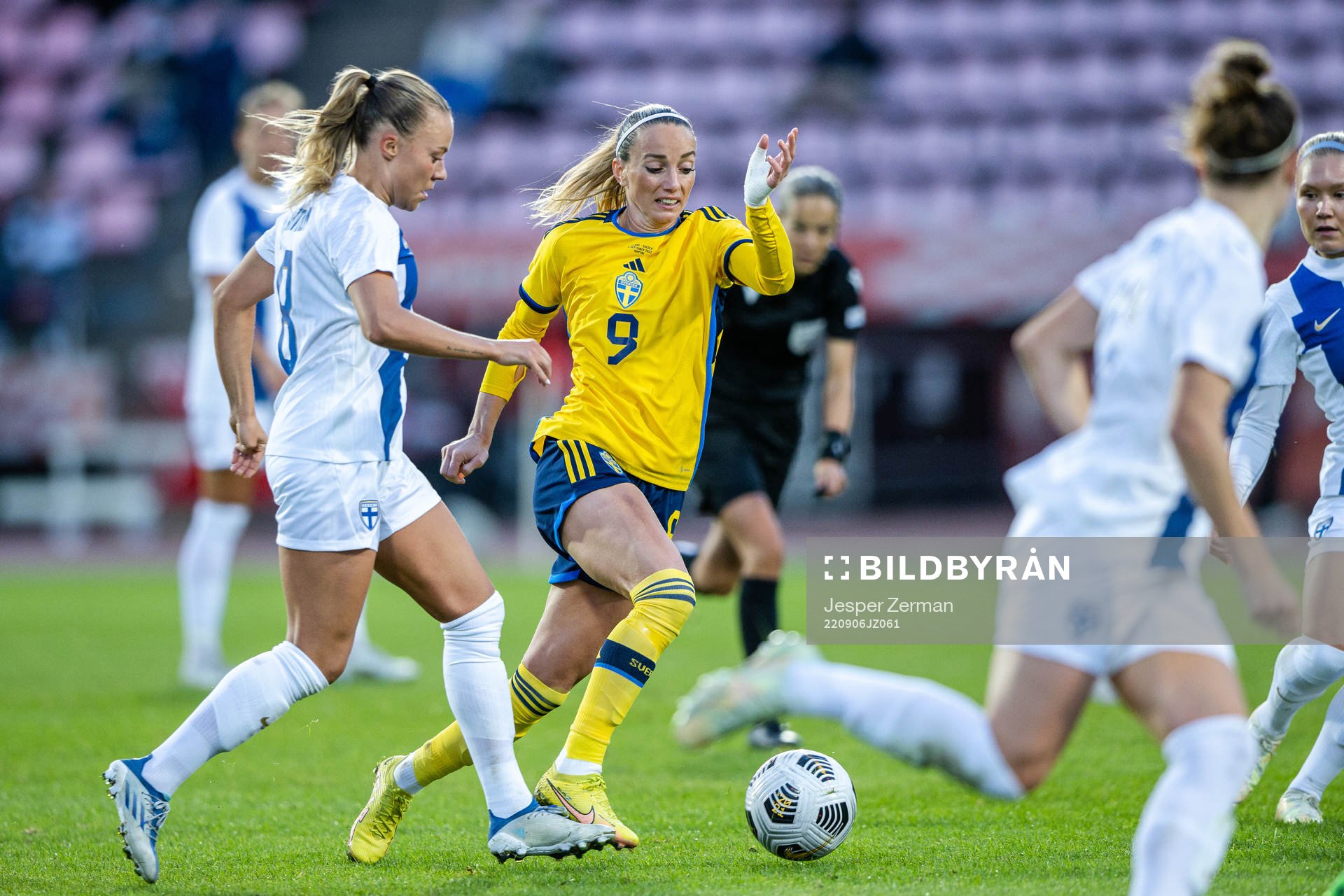 Olga Ahtinen of Finland and Kosovare Asllani of Sweden