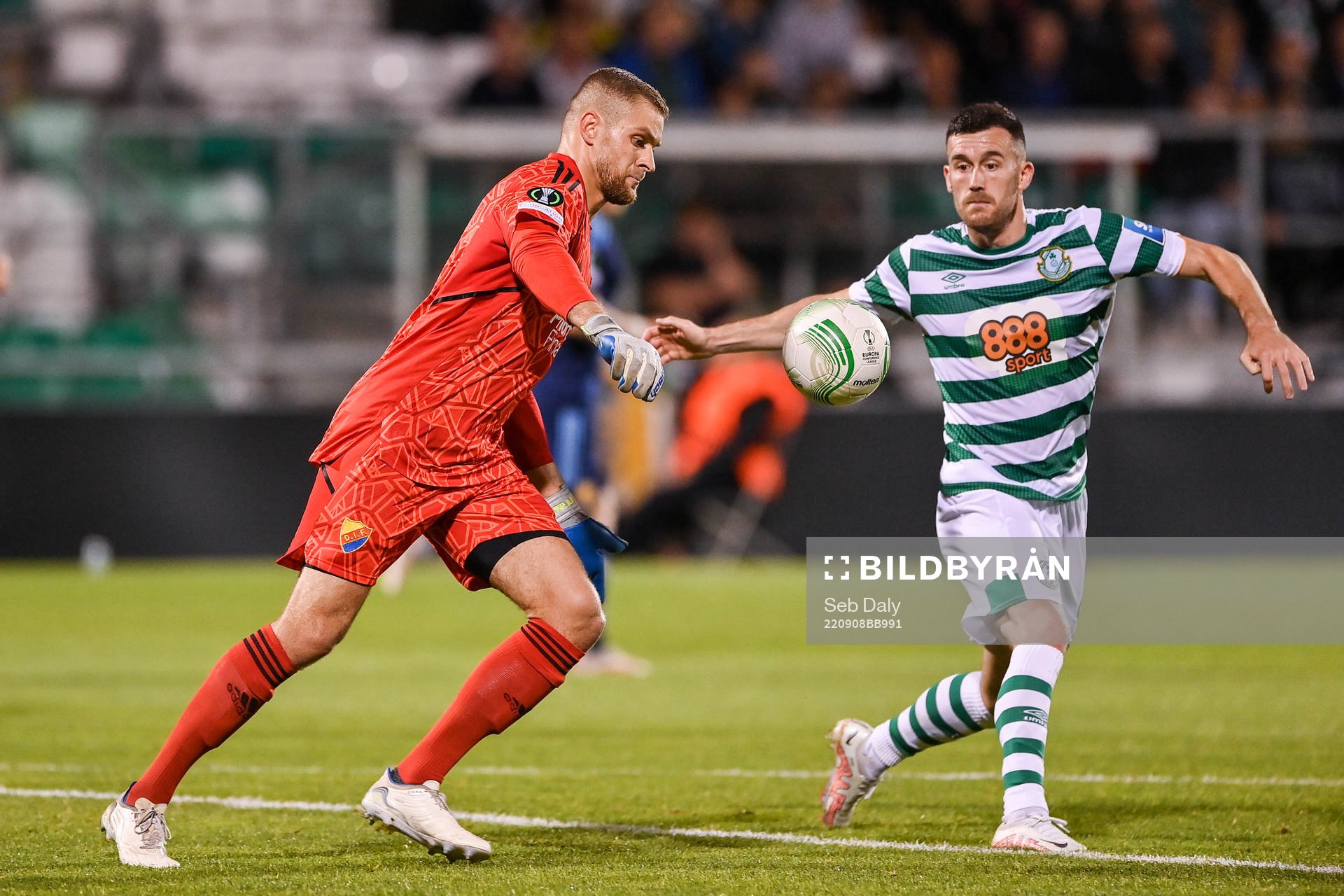 goalkeeper Aleksandr Vasiutin of Djurgården and Aaron Greene of Shamrock Rovers during the UEFA Conference League group match between Shamrock Rovers and Djurgården on September 8, 2022 in Dublin.