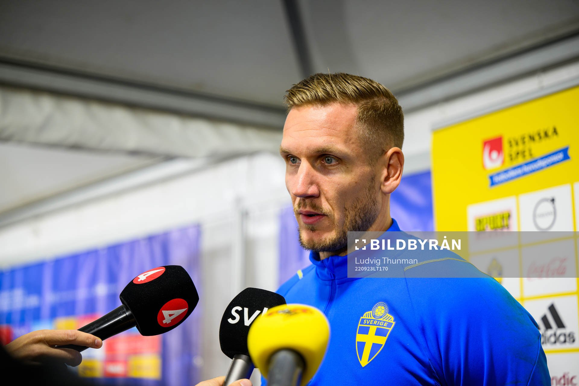 Goalkeeper Robin Olsen is interviewed by the media