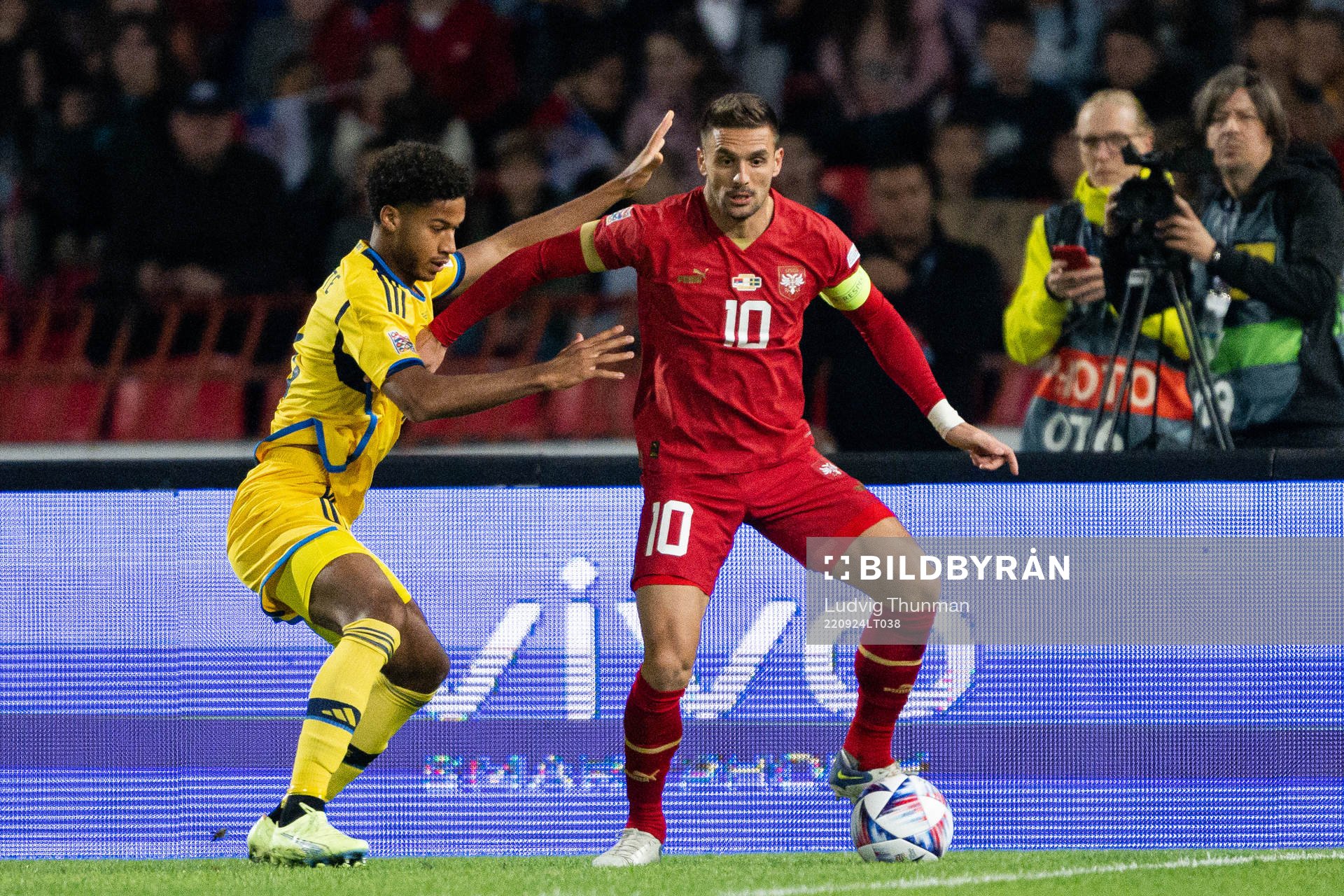 Jens Cajuste of Sweden and Dusan Tadic of Serbia