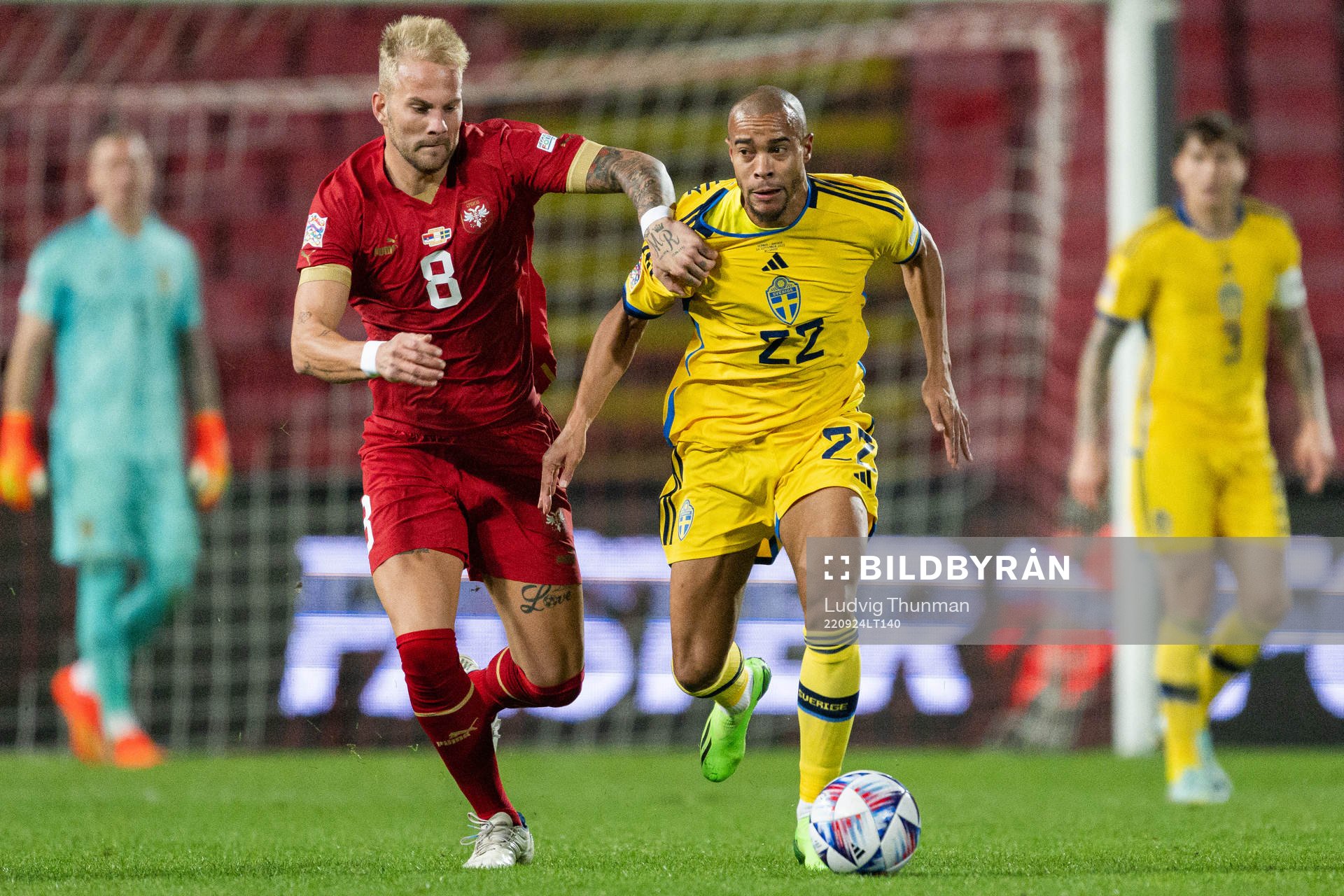 Uros Racic of Serbia and Robin Quaison of Sweden