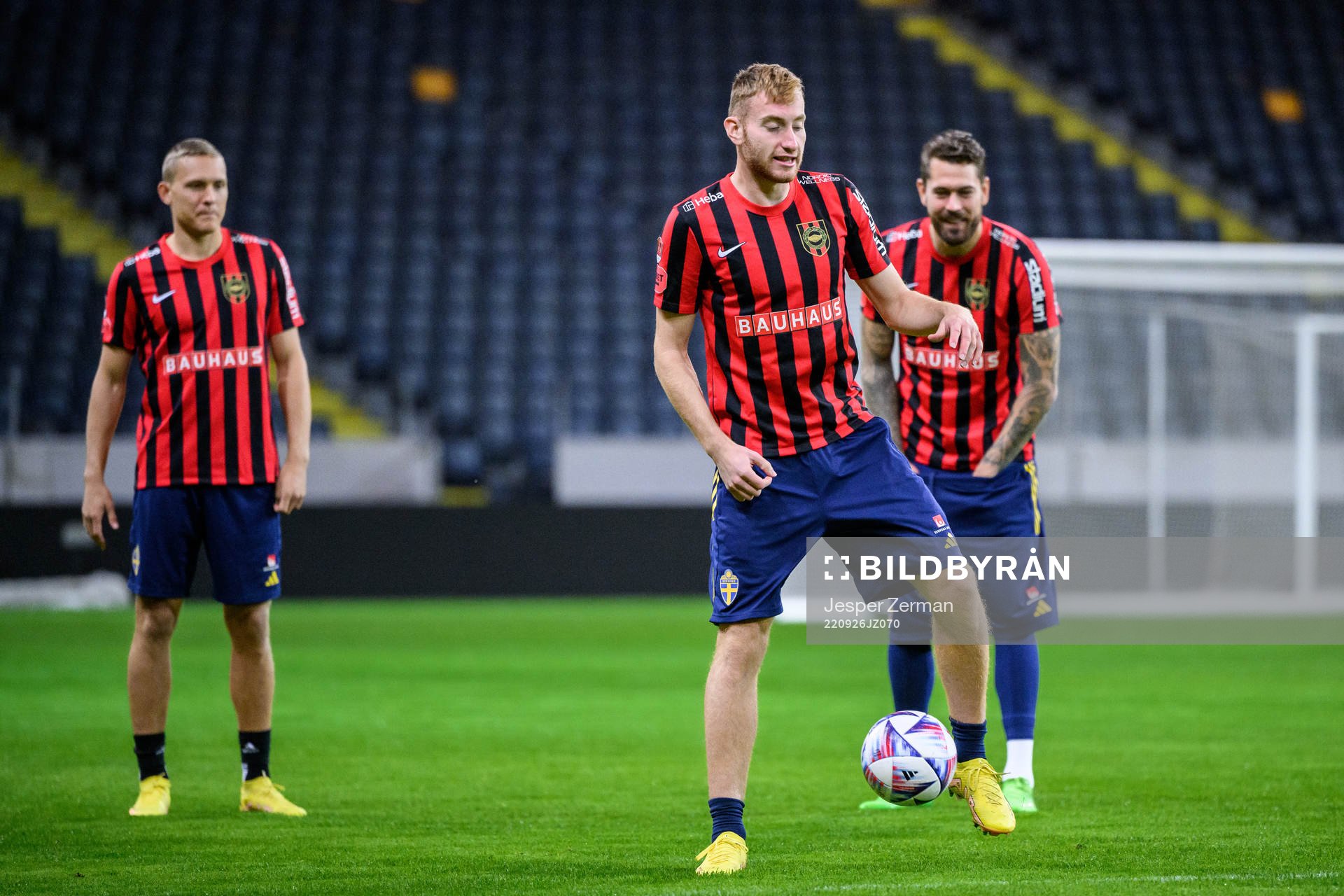 Ludwig Augustinsson, Dejan Kulusevski and goalkeeper Kristoffer Nordfeldt wearing jerseys from their parent clubs during a training session with the Swedish national football team on September 26, 2022 in Stockholm.