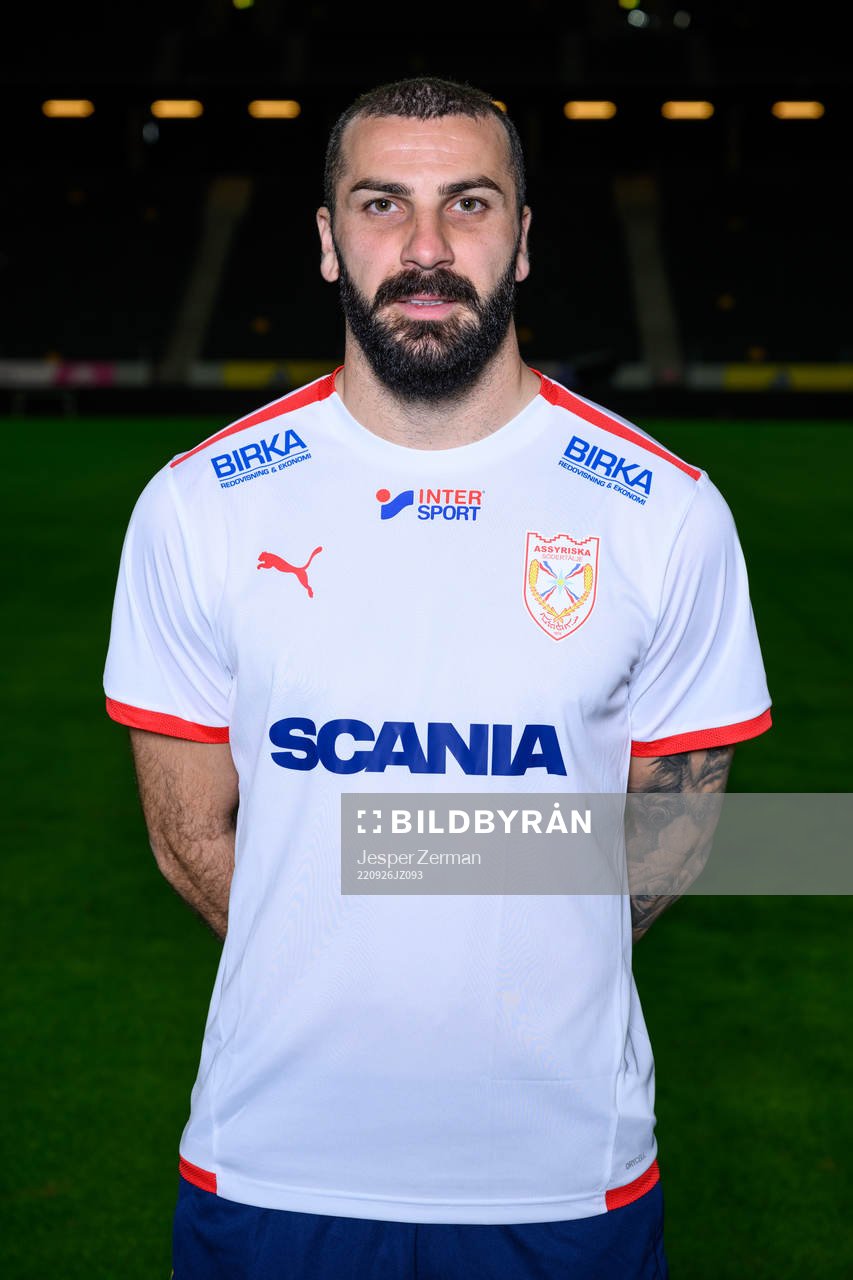 Mikael Ishak poses for a portrait with the jersey of his