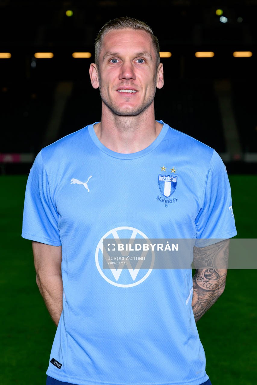 goalkeeper Robin Olsen poses for a portrait with the jersey of his parent club Malmö FF during a training session with the Swedish national football team on September 26, 2022 in Stockholm.