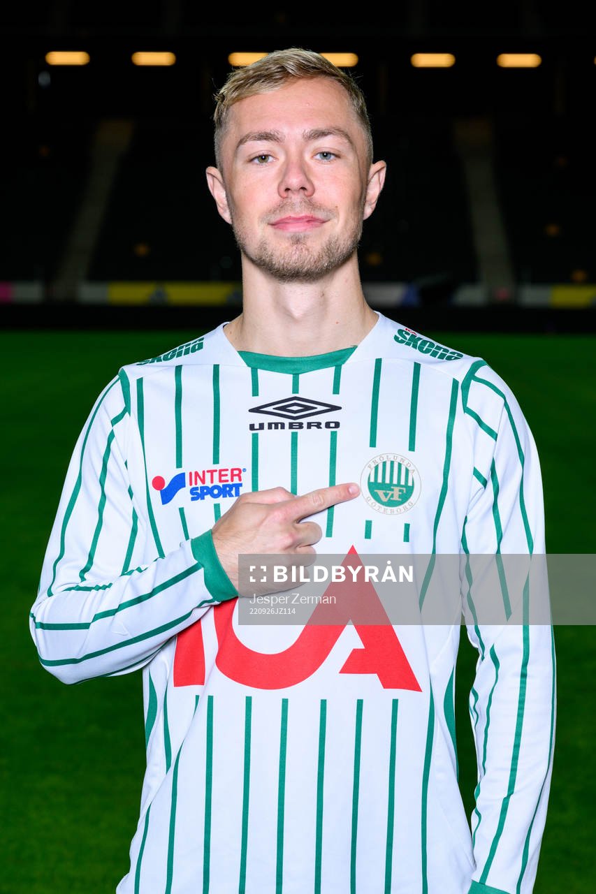 Joel Andersson poses for a portrait with the jersey of his
