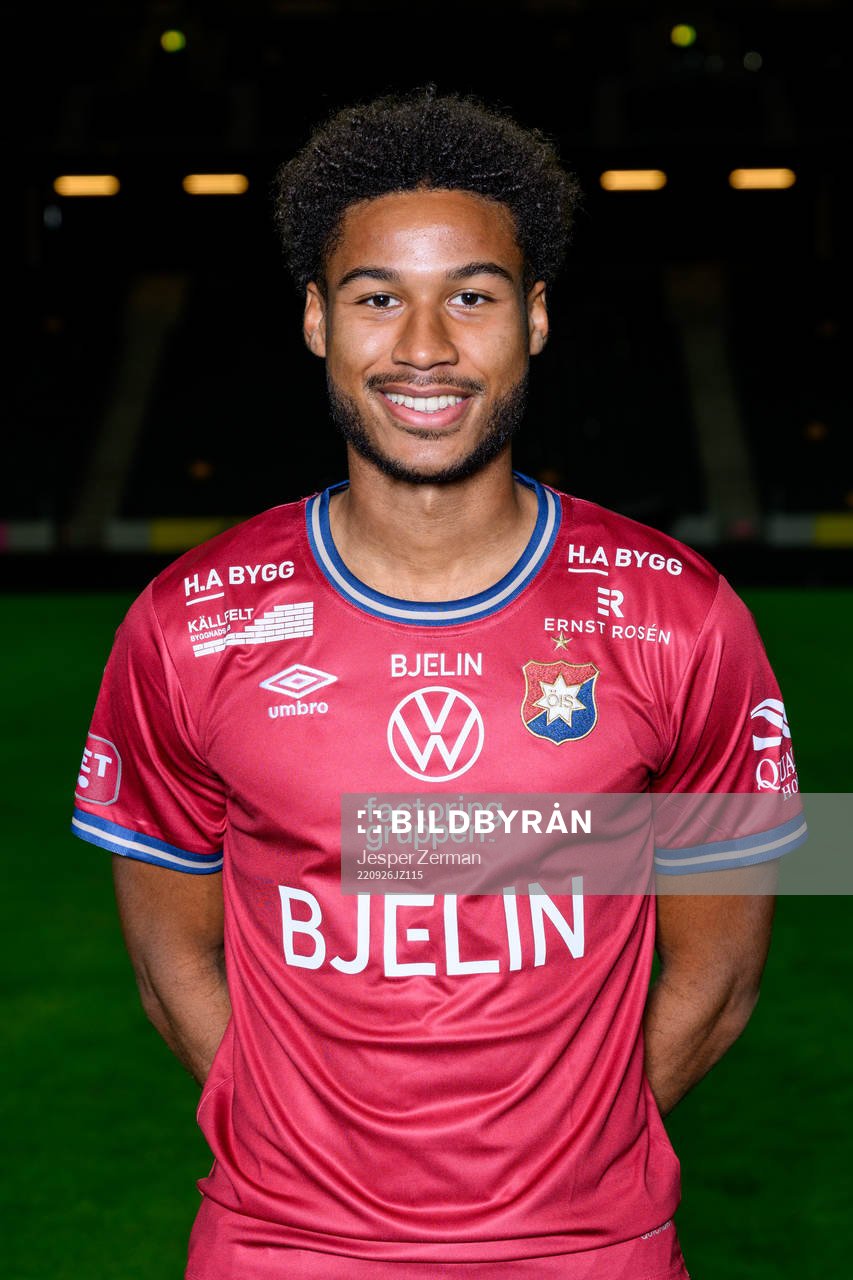 Jens Cajuste poses for a portrait with the jersey of his