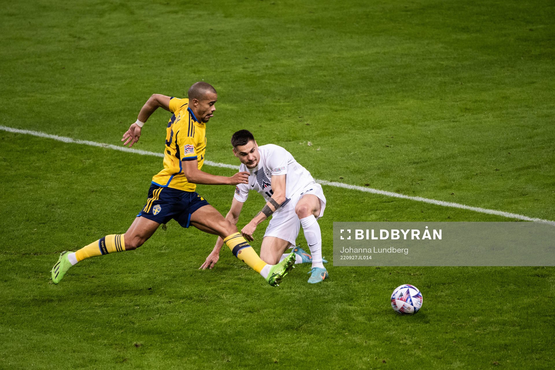 Robin Quaison of Sweden and Gregor Sikosek of Slovenia
