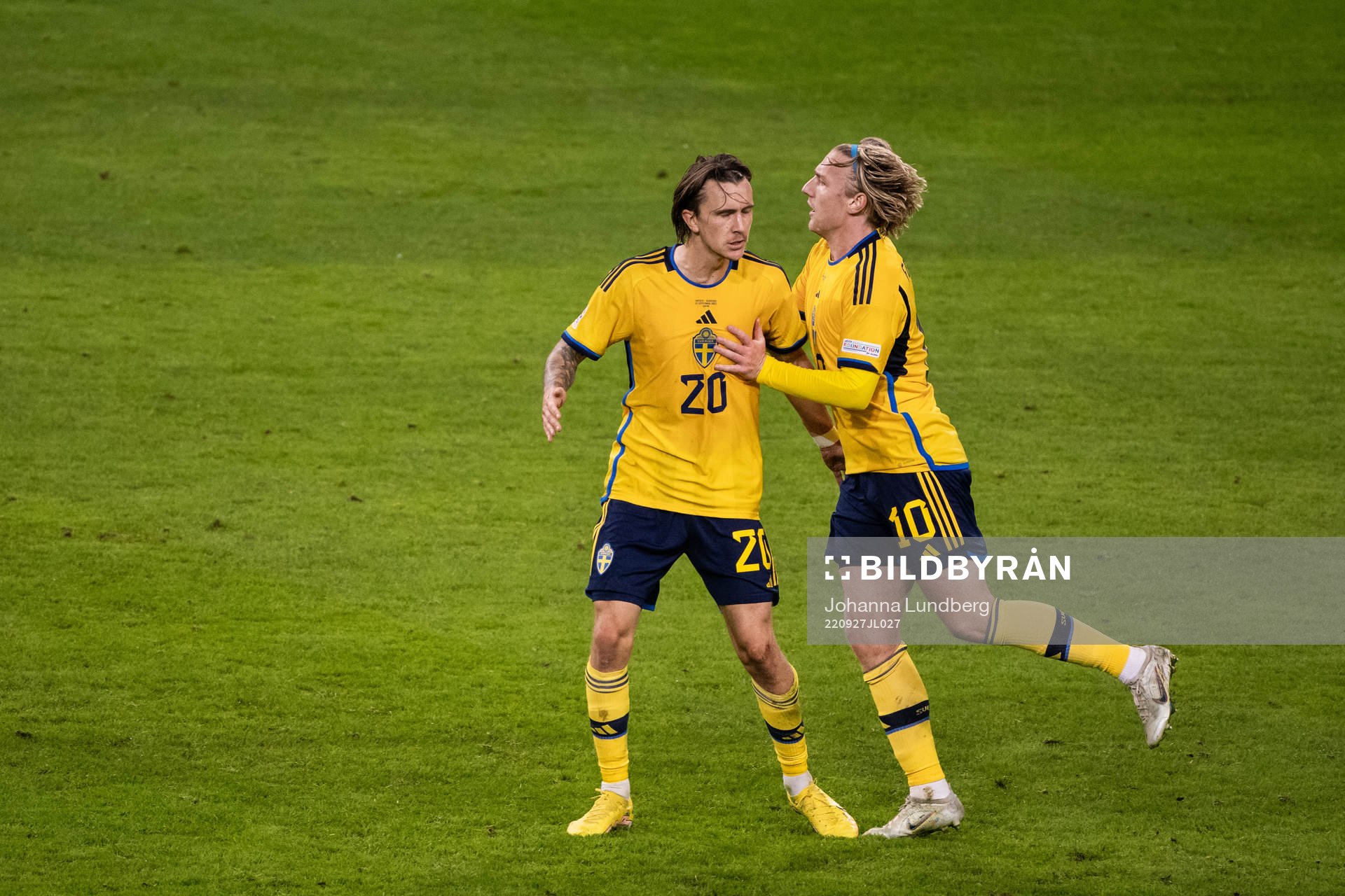 Kristoffer Olsson and Emil Forsberg of Sweden celebrate
