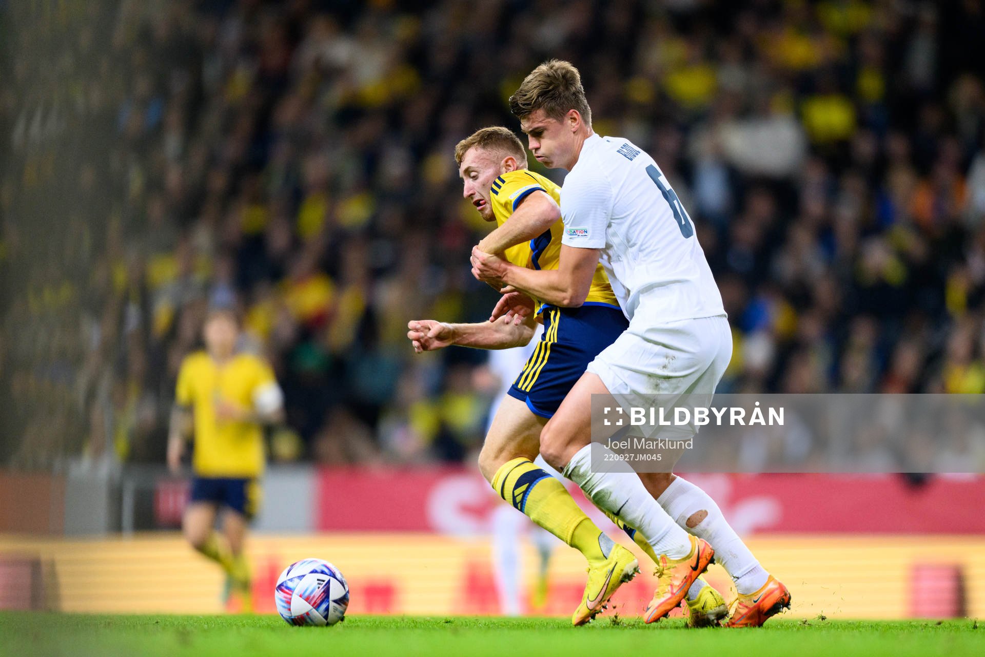 Dejan Kulusevski of Sweden and Jaka Bijol of Slovenia