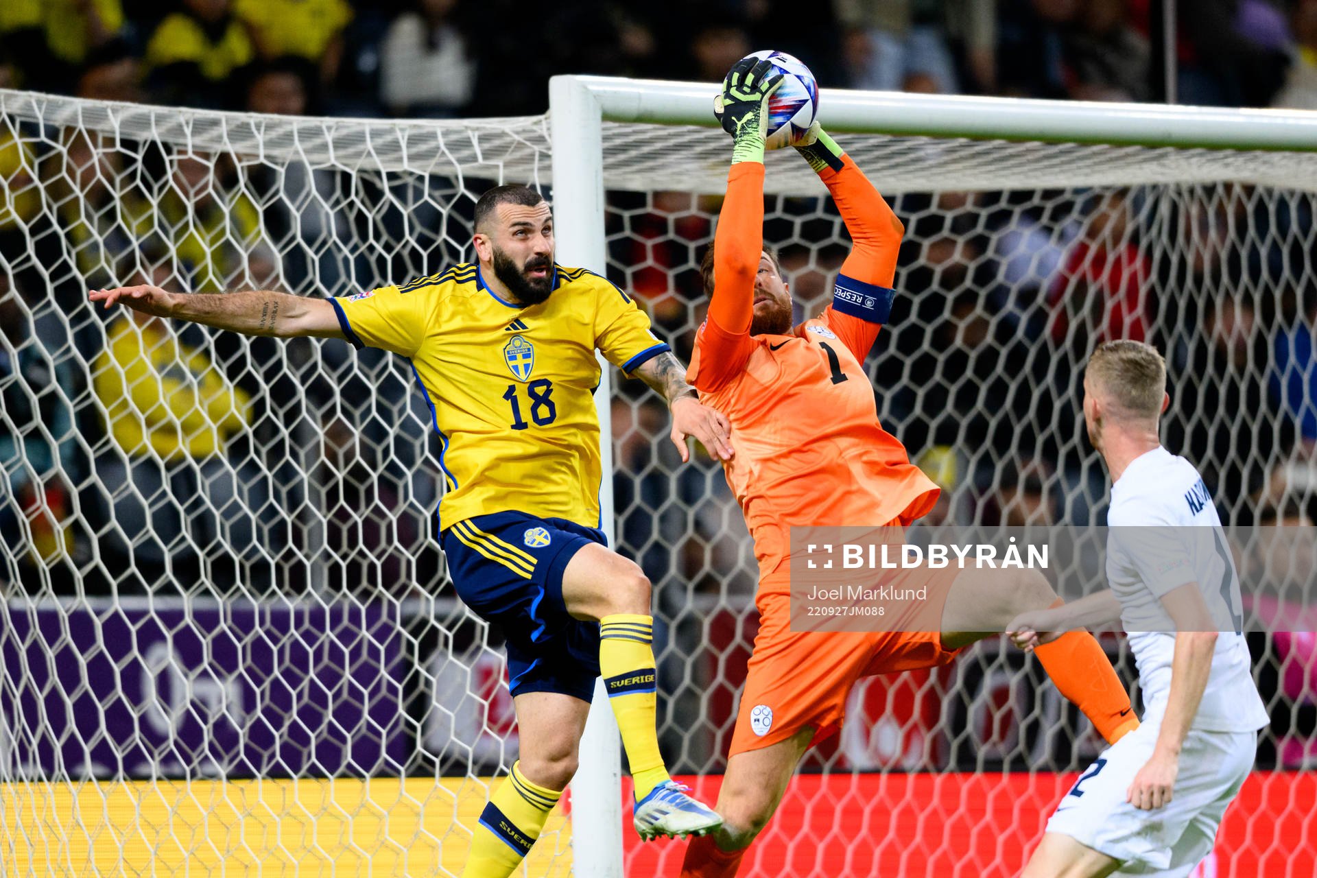 Mikael Ishak of Sweden and goalkeeper Jan Oblak of Slovenia
