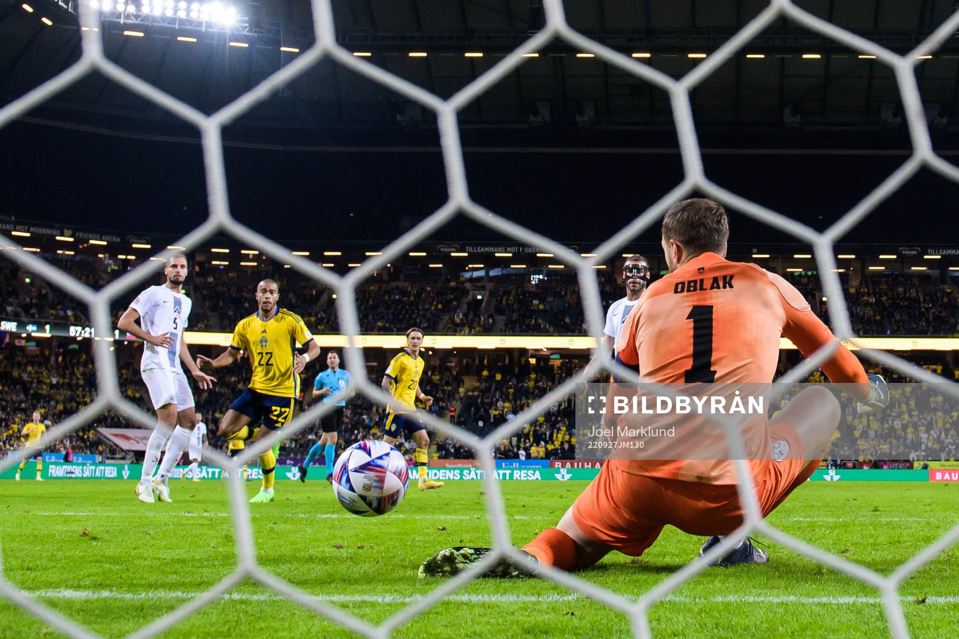 Goalkeeper Jan Oblak of Slovenia saves a ball from Robin