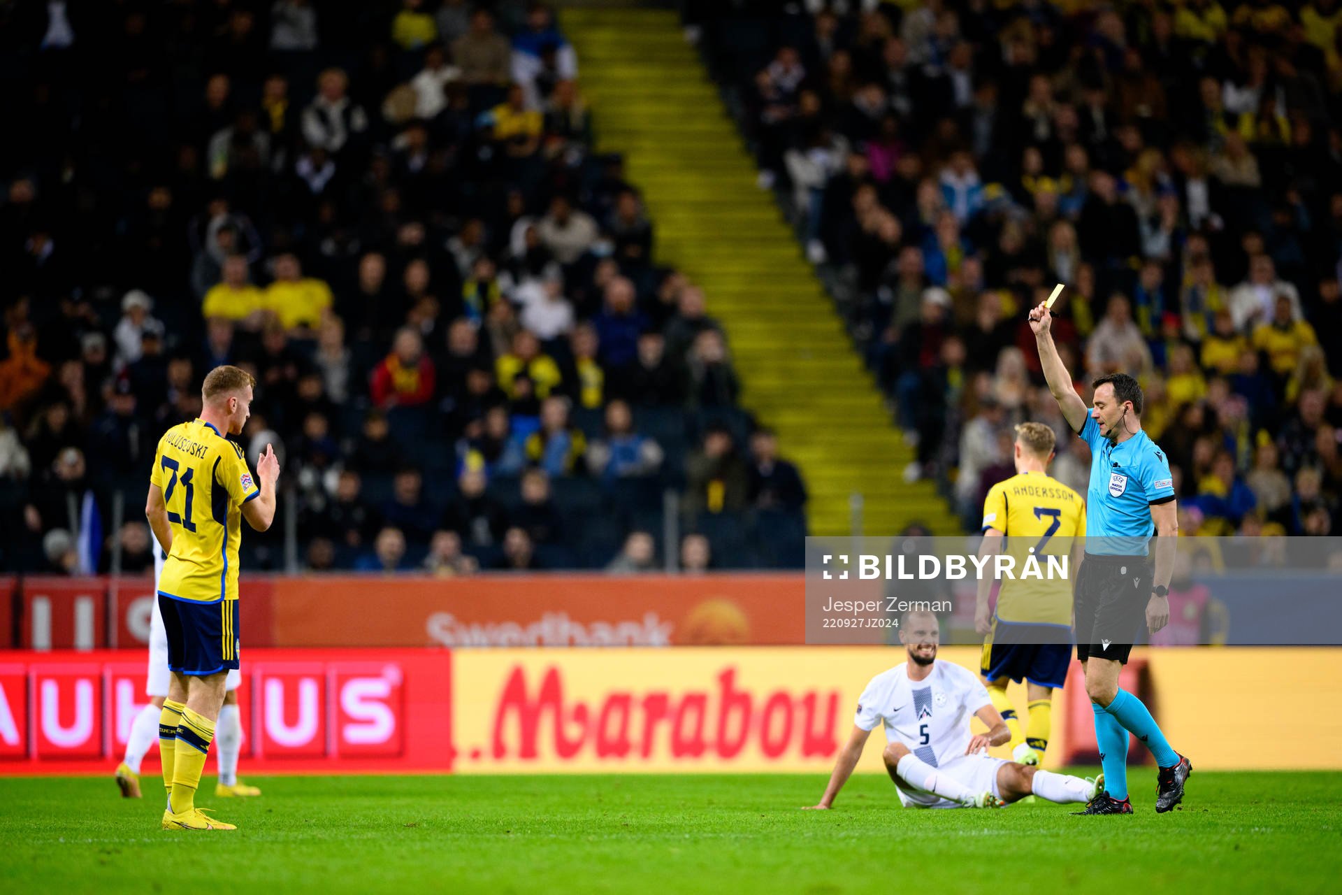 Dejan Kulusevski of Sweden receives a yellow card