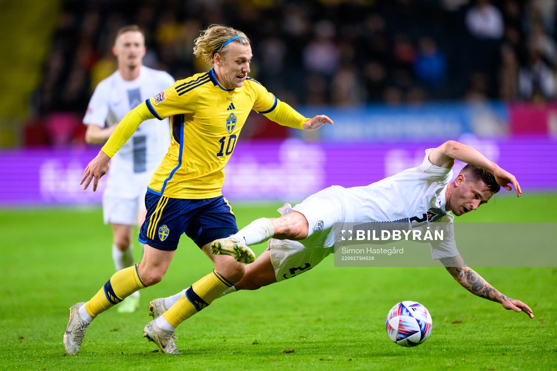 Emil Forsberg of Sweden and Benjamin Verbic of Slovenia