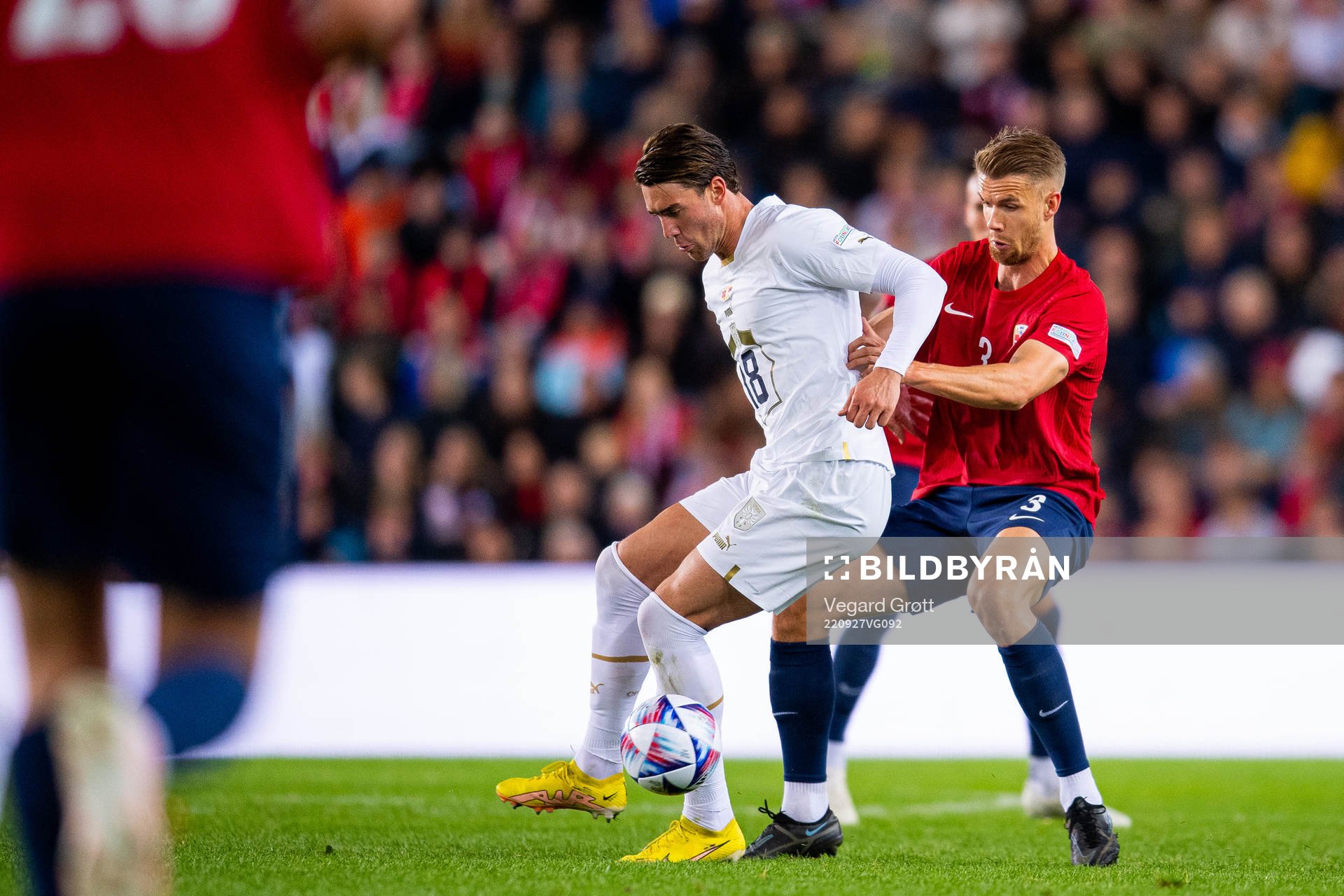 Dusan Vlahovic of Serbia and Kristoffer Ajer of Norway