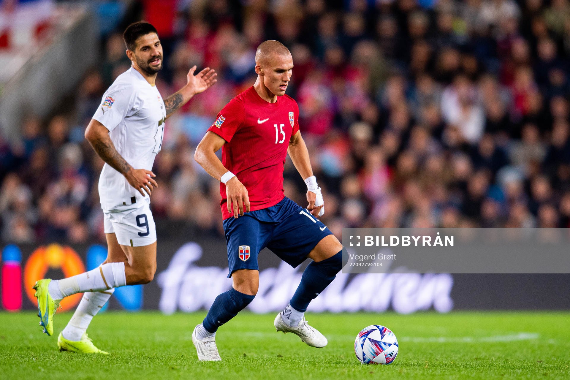 Aleksandar Mitrovic of Serbia and Leo Skiri Østigård of