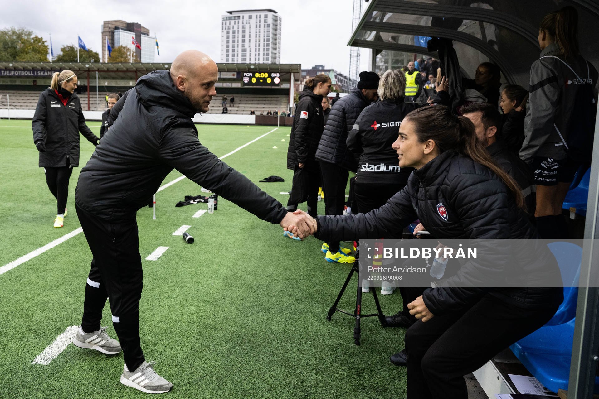 Head coach Olli Harder of Brann greets Head coach Renee