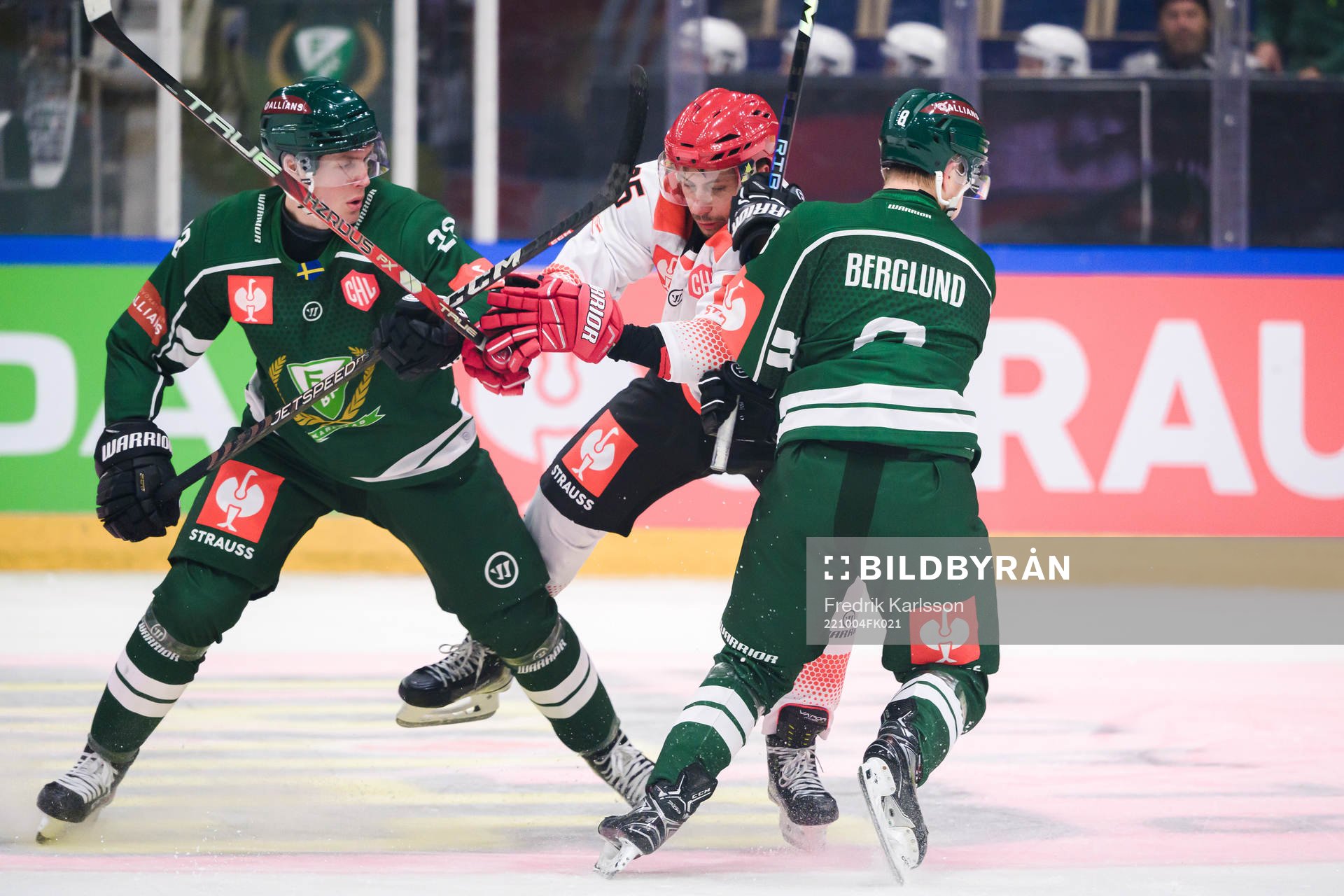 Lucas Forsell of Färjestad and Anton Berglund with Damian