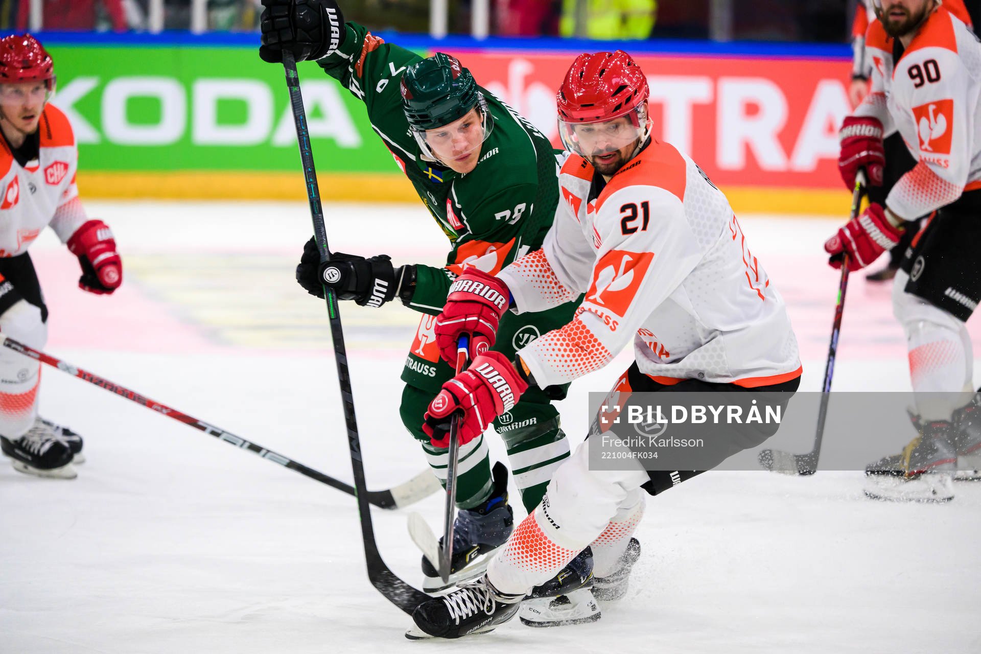 Patrik Lundh of Färjestad and Marek Racuk of Cracovia