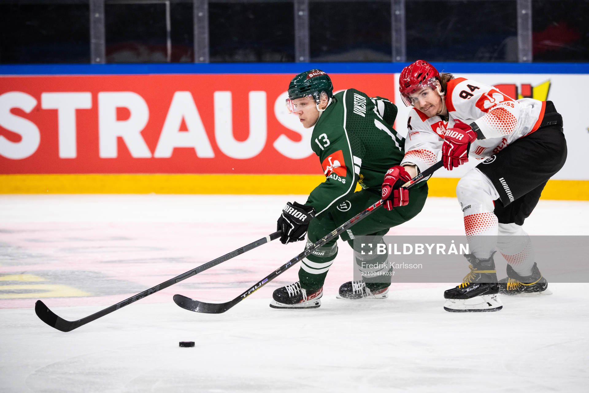 Daniel Viksten  of Färjestad and Stepan Csamango of