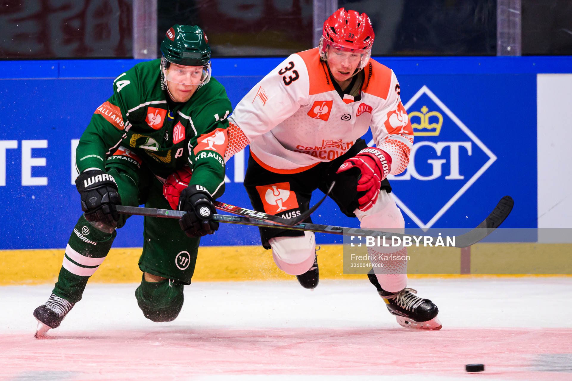 Victor Ejdsell of Färjestad and Jakub Saur of Cracovia