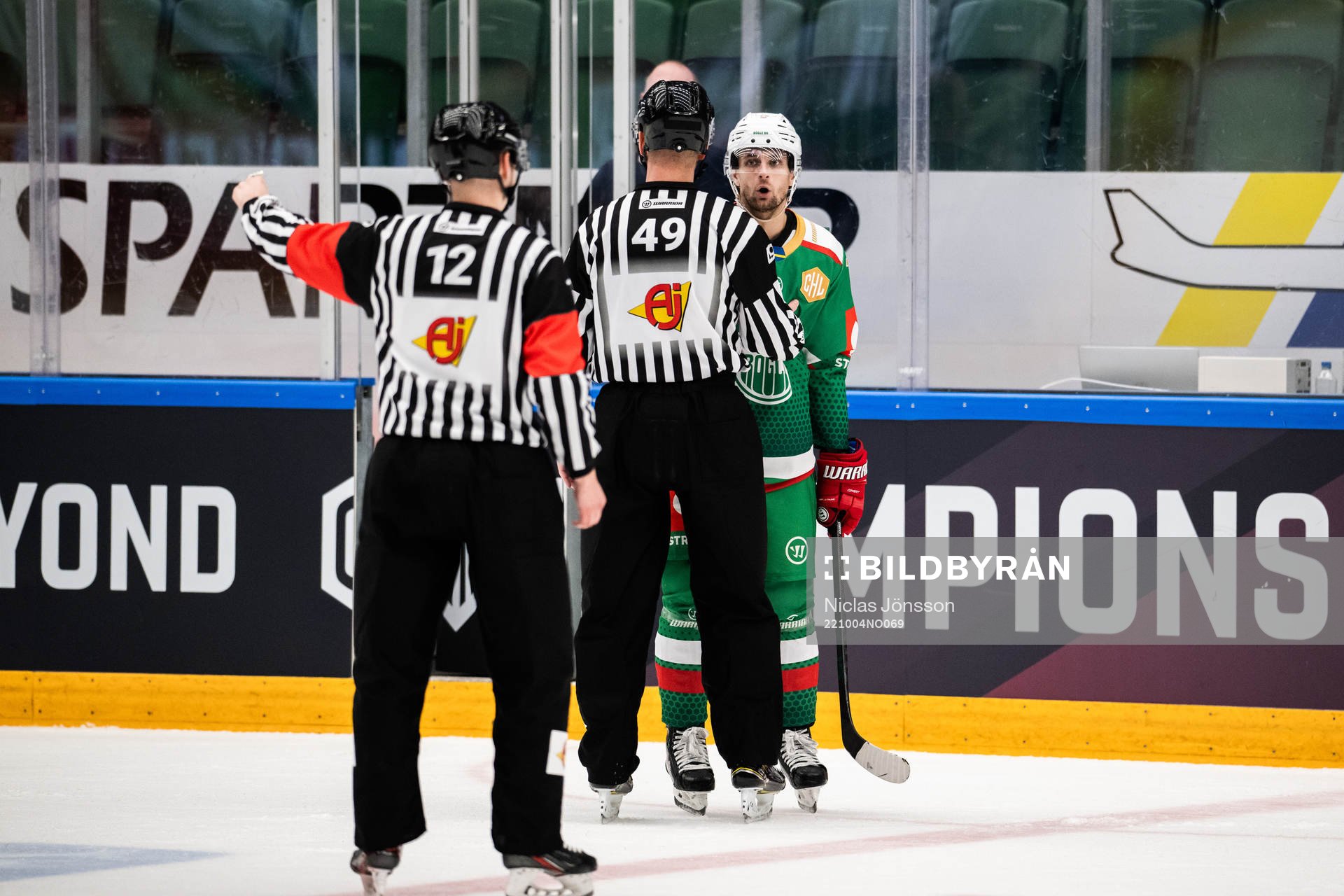 Daniel Zaar of Rögle and Referee Emils Druseiks