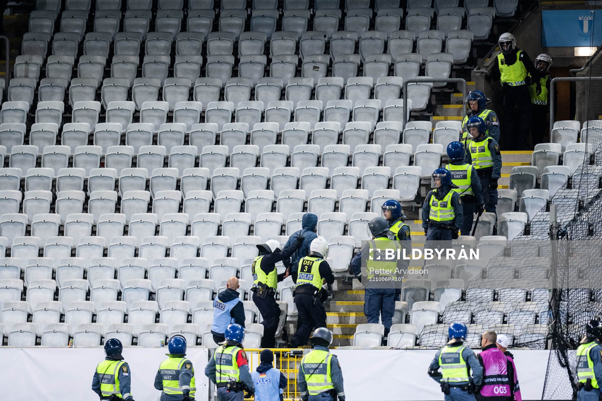 Police arresting a supporter