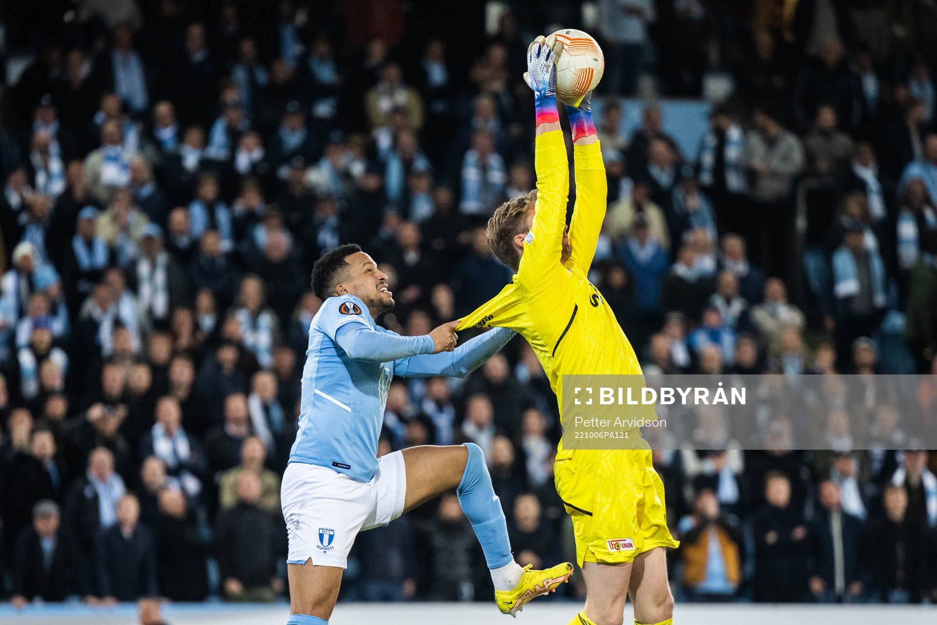 Martin Olsson of Malmö FF and goalkeeper Frederik Rönnow
