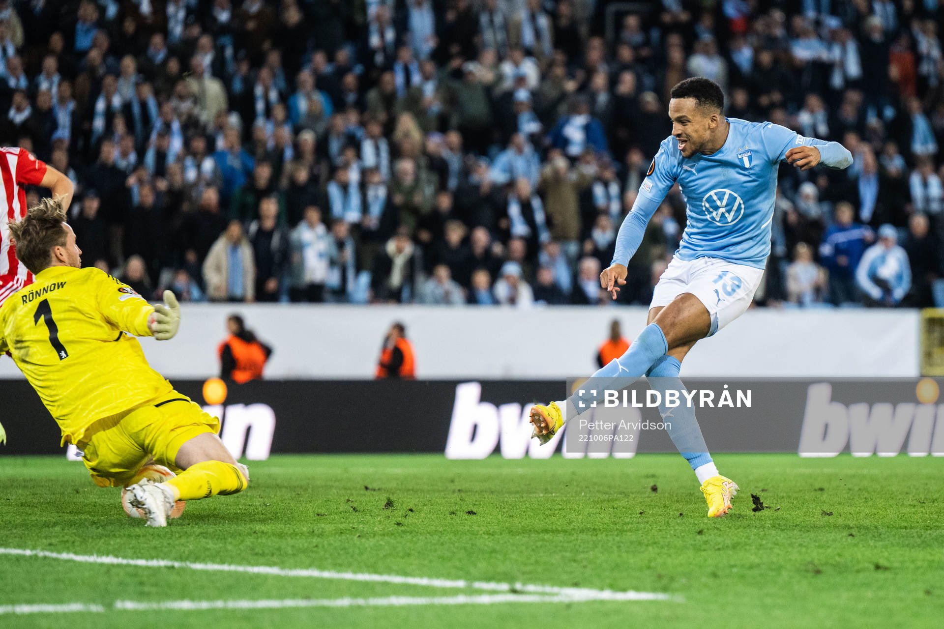 Martin Olsson of Malmö FF and goalkeeper Frederik Rönnow