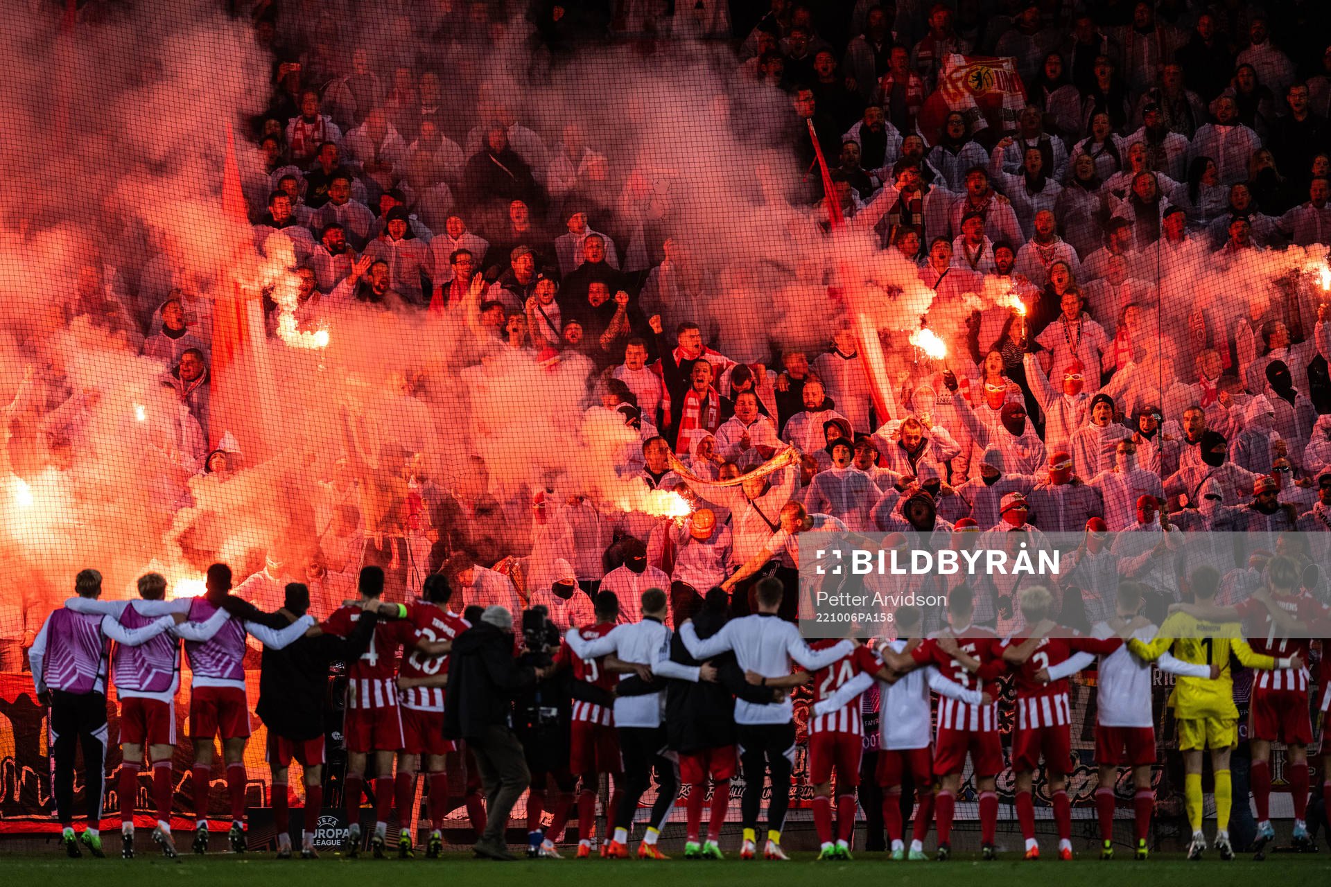 Players of Union Berlin celebrate with supporters in the