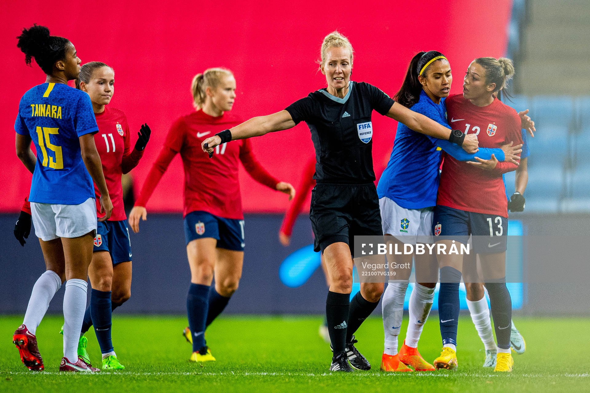 Tainara of Brazil, referee Lina Lehtovaara and Celin Bizet Ildhusøy of Norway during the international friendly football match between Norway and Brazil on October 7, 2022 in Oslo.