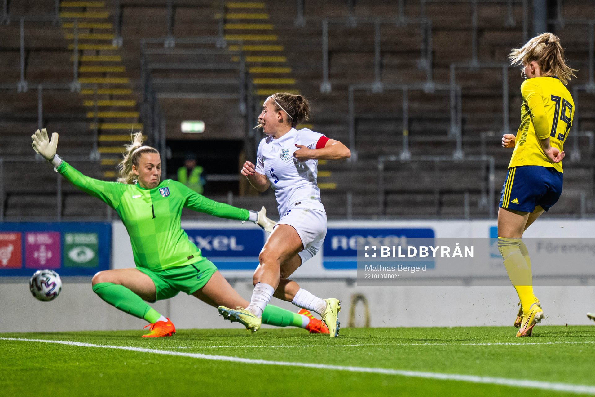 Matilda Vinberg of Sweden scores 1-1 behind goalkeeper