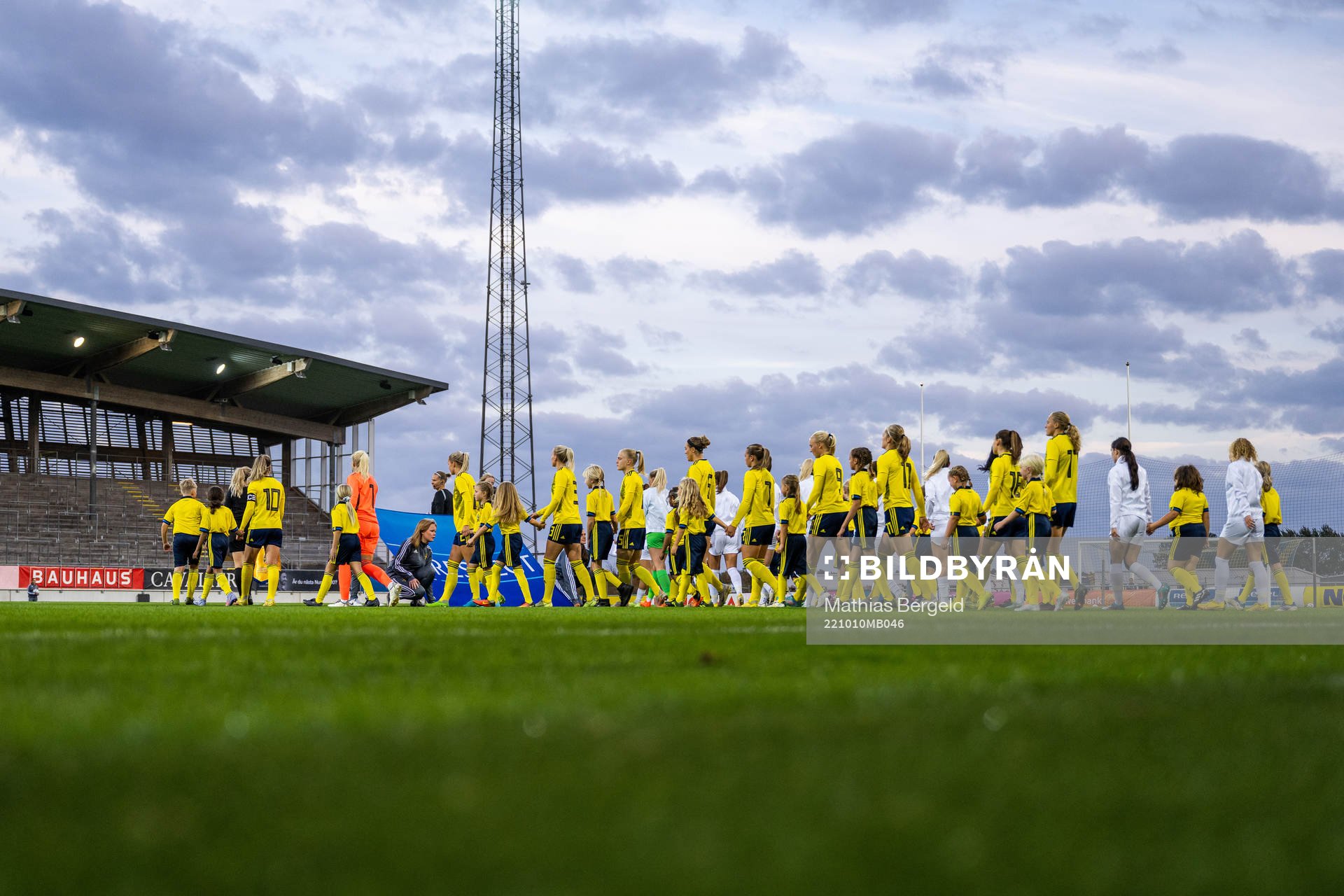 The teams enter the pitch
