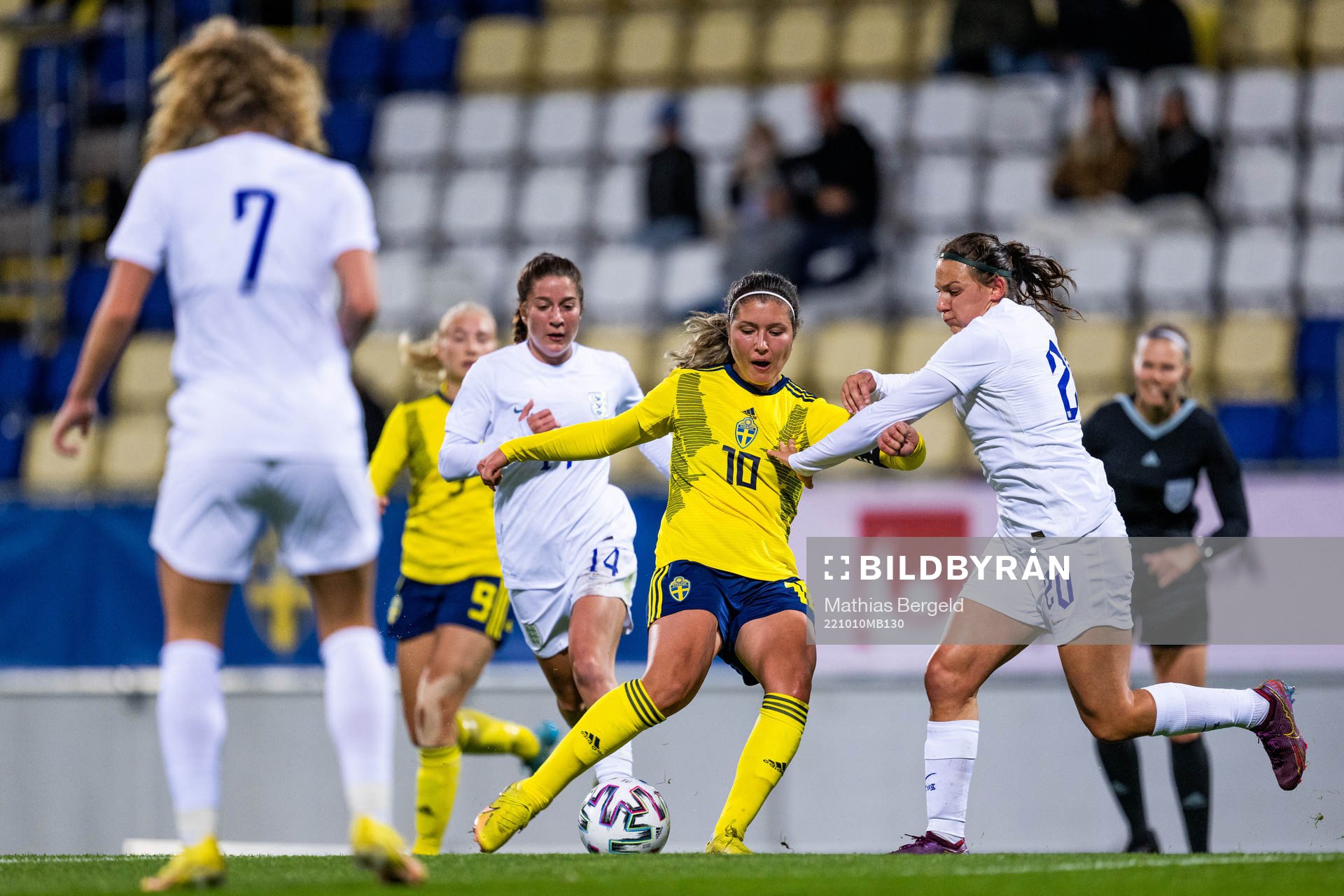 Ruby Grant and Mel Filis of England defend against Loreta