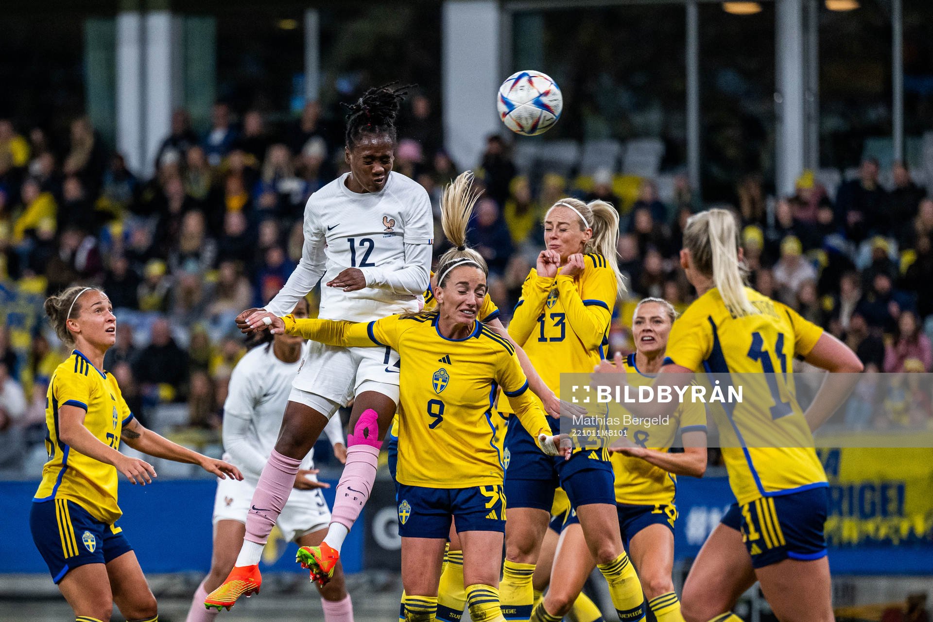 Melvine Malard of France competes with Kosovare Asllani and