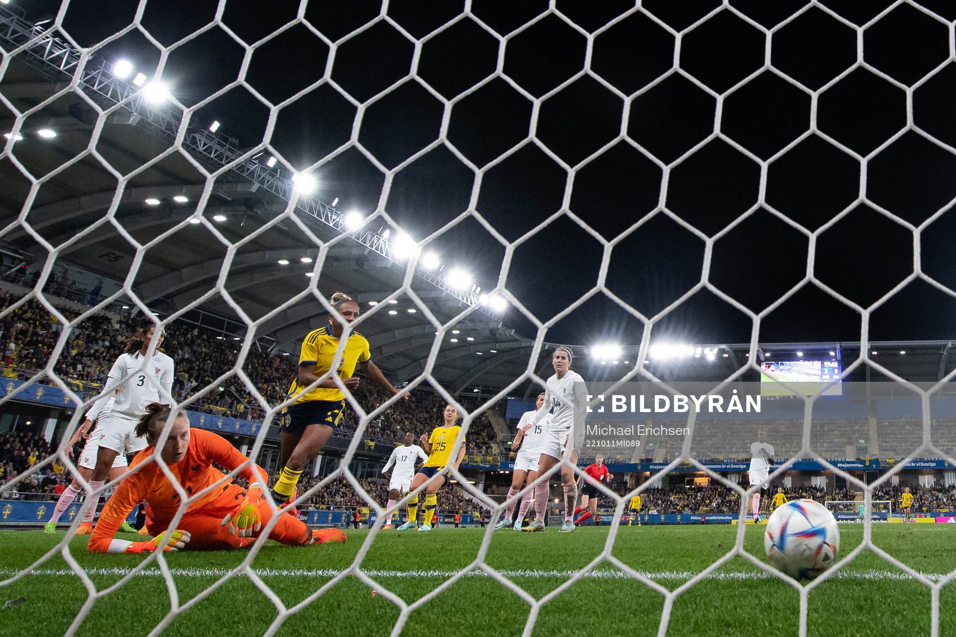 Madelen Janogy of Sweden scores 3-0 behind goalkeeper